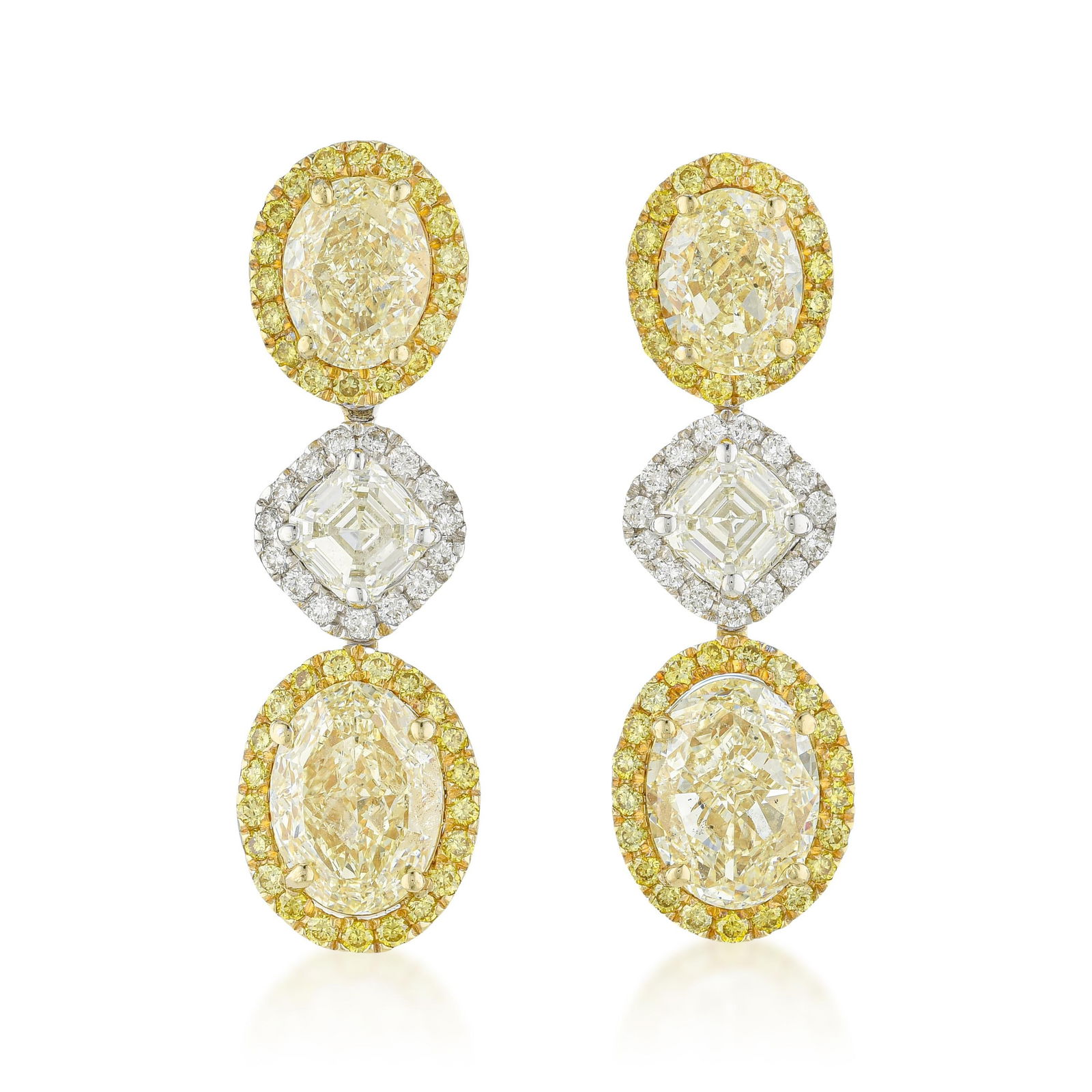 Fancy Yellow and White Diamond Hanging Earrings: Summary of Key Characteristics • Metal: 18K yellow / white gold • Gemstone(s): (6) mix shape diamonds approx. 7.16 carats total, most fancy yellow/VS-SI, H-I/VS • Measurements: 1