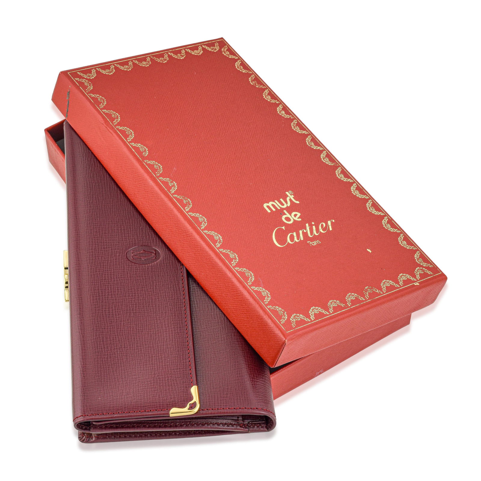 Cartier Burgundy Leather Must de Cartier Trifold Continental Wallet, with Box: This Cartier Must de Cartier Trifold Continental Wallet is crafted from rich burgundy smooth leather and accented with refined gold-tone hardware, reflecting the timeless elegance of Cartier’s