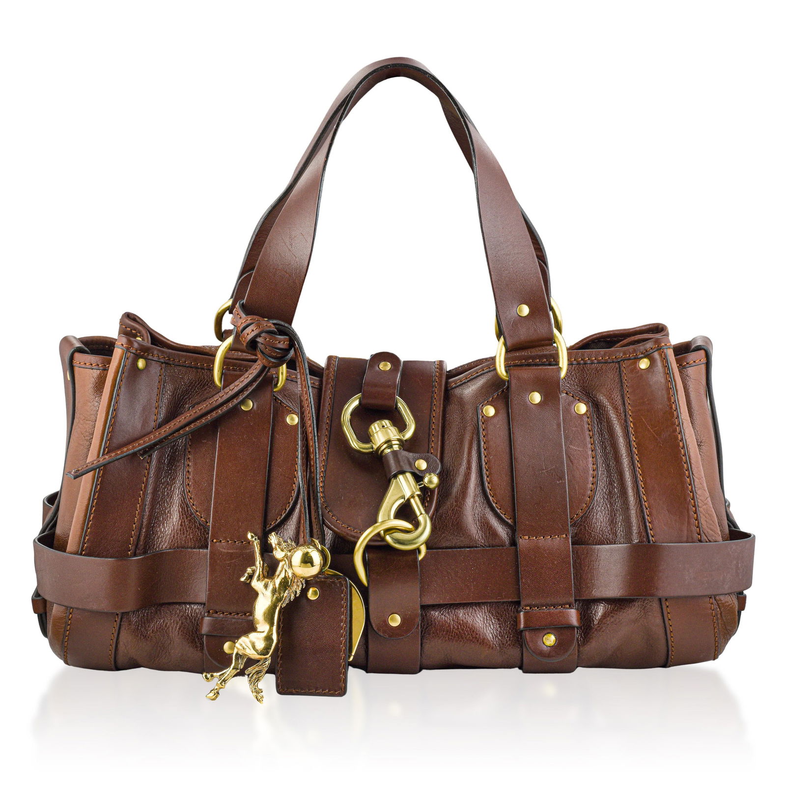 Chloe Kerala Leather Tote Bag in Brown with Horse Charm: This elegant Chloe Kerala Leather Tote Bag is a heritage-inspired design crafted from richly vegetable-tanned calfskin leather in a warm brown hue. Known for its slouchy, retro silhouette, the Kerala