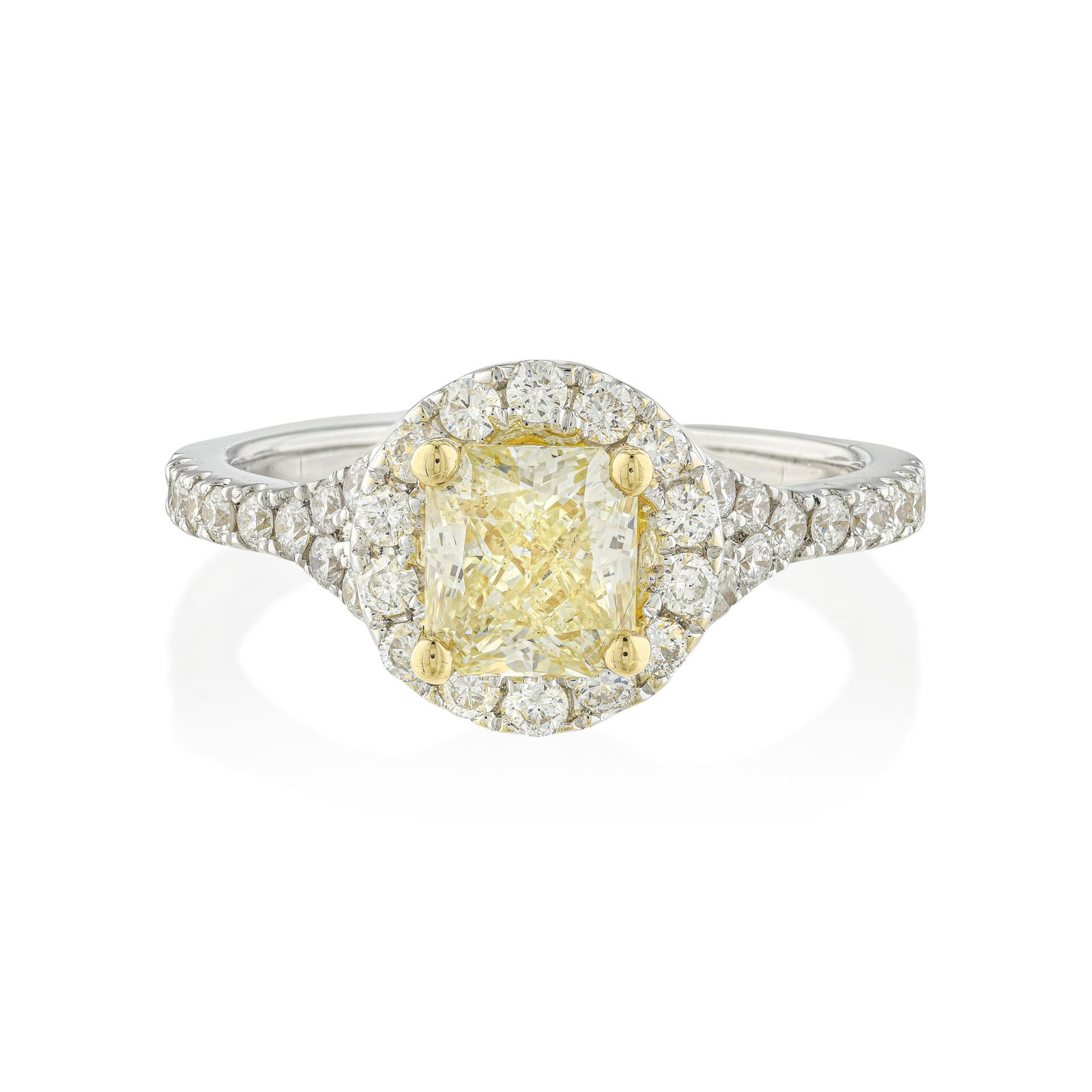 3.01-Carat Fancy Yellow Diamond and Diamond Ring: Summary of Key Characteristics • Metal: 18K yellow / white gold • Gemstone(s): Radiant cut diamond 3.01 carat fancy yellow/VS; round brilliant cut diamonds 0.75 carats total •