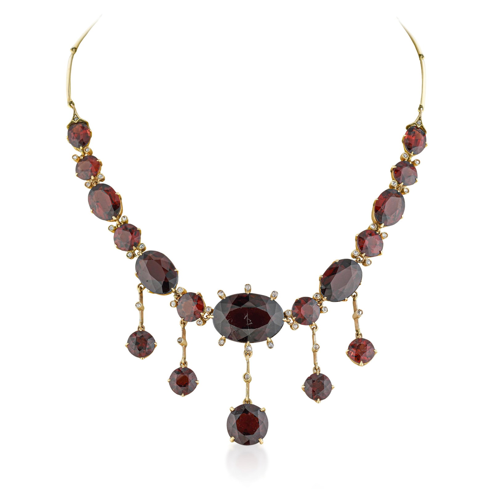 An Exceptional Antique Garnet and Gold Necklace: An exceptional 19th-century necklace, finely crafted in 14K yellow gold and set with over 70 carats of richly saturated garnets. The design presents a beautifully graduated sequence of oval and