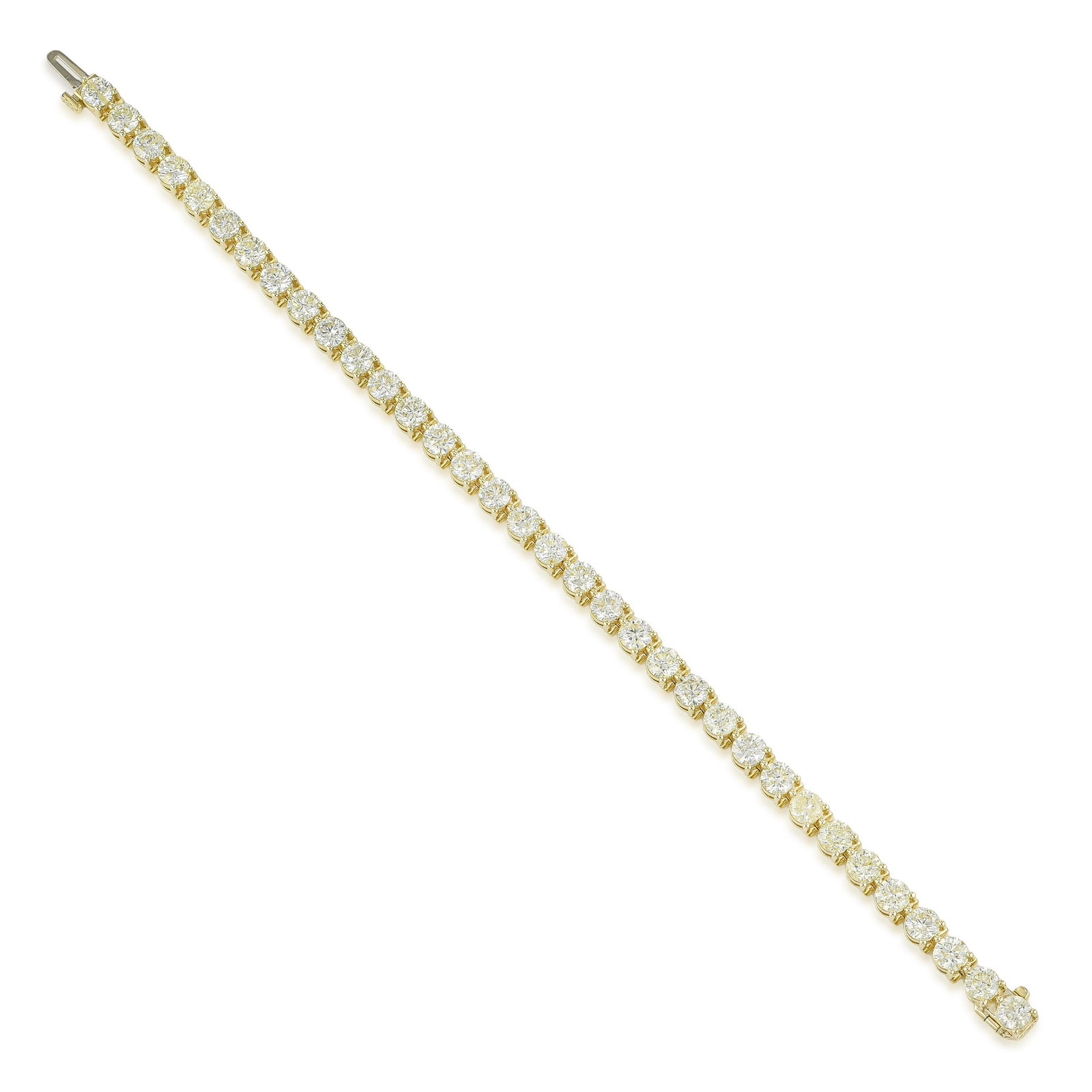 3 Prong Martini Tennis Bracelet: Summary of Key Characteristics • Metal: 14K yellow gold • Gemstone(s): Round brilliant cut diamonds approx. 10.03 carats total, most I-J/I1 • Measurements: 7 inches length 