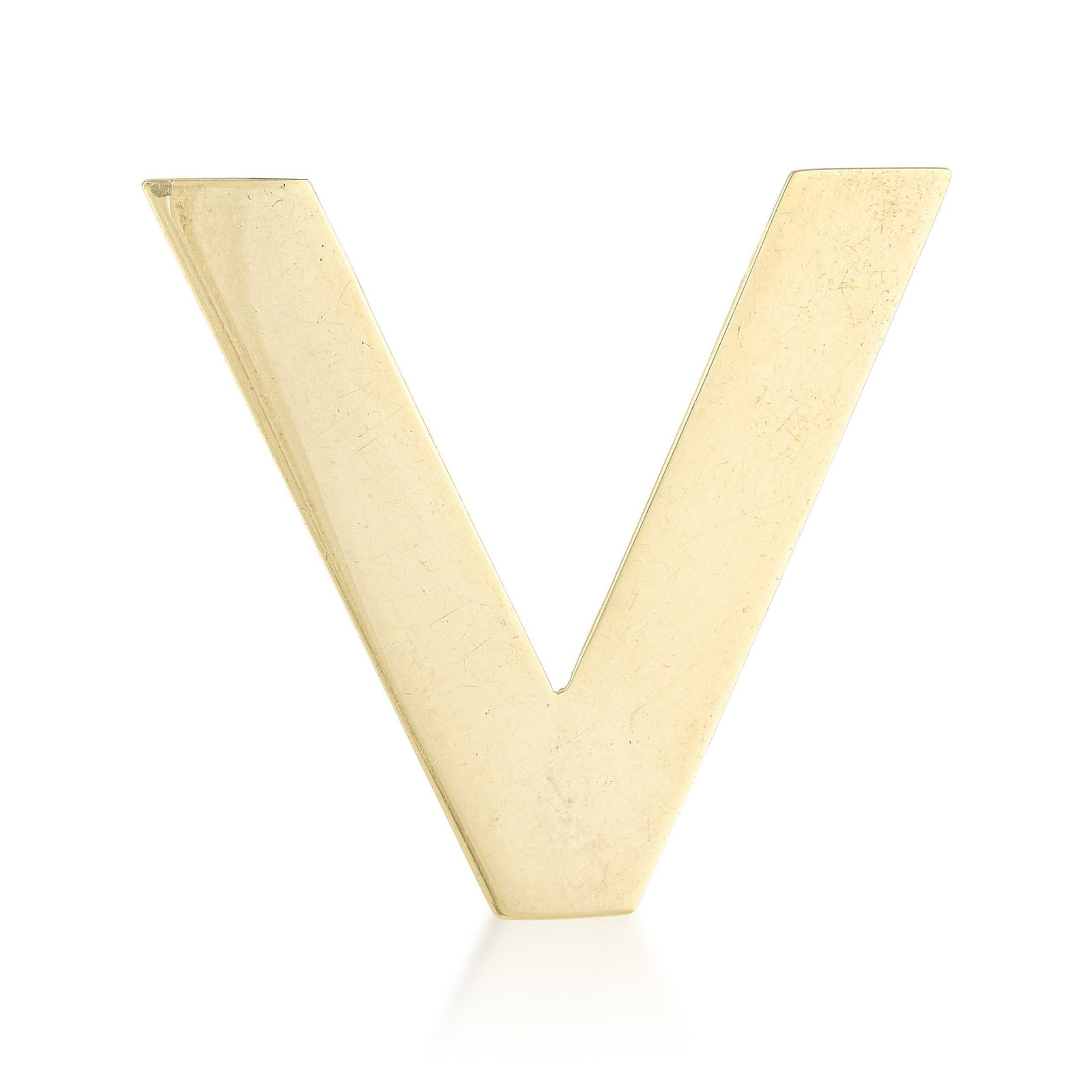 Tiffany & Co. Gold Letter 'V' Pin: Summary of Key Characteristics • Metal: 14 K yellow gold • Measurements: 1 1/2 inch long • Weight: 6.8 g. • Condition: In excellent condition, light scratches throughout. 