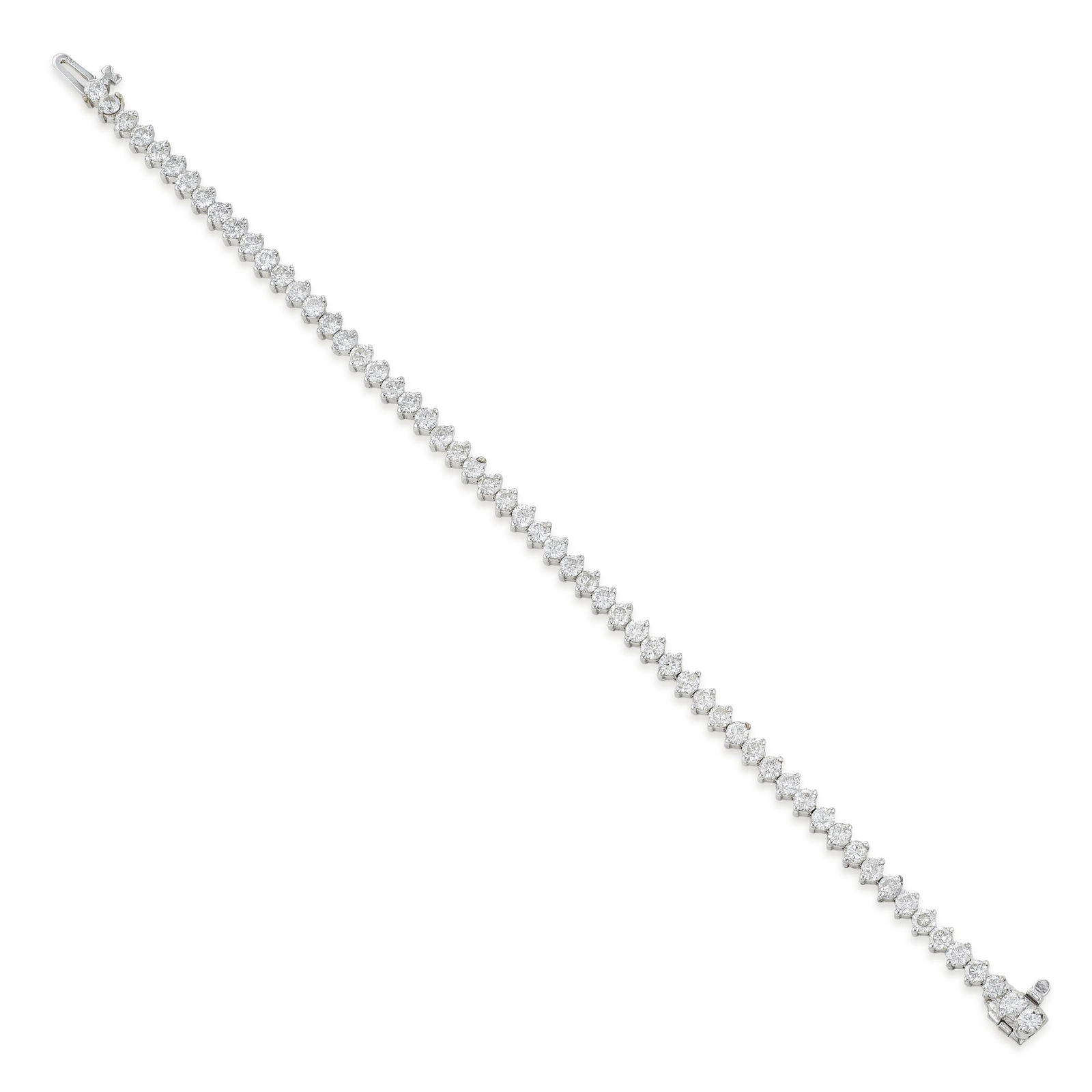 Diamond Tennis Bracelet (Approx. 6 CTW): Summary of Key Characteristics • Metal: 14K white gold • Gemstone(s): Round brilliant cut diamonds approx. 6.00 carats total, most H-I/I • Measurements: 7 inch length •
