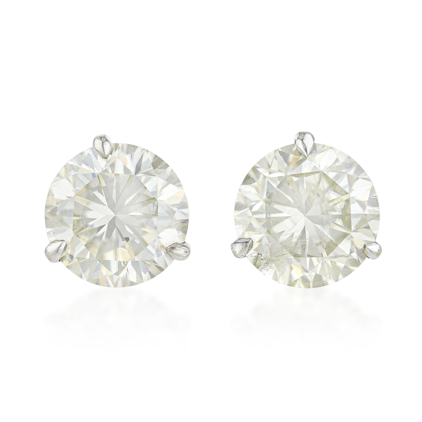 Diamond Stud Earrings (Approx. 6.02 CTW): Summary of Key Characteristics • Metal: 14K white gold • Gemstone(s): a pair of round brilliant cut diamonds approx. 6.02 carats total, most J-K/SI • Measurements: 8 mm top 