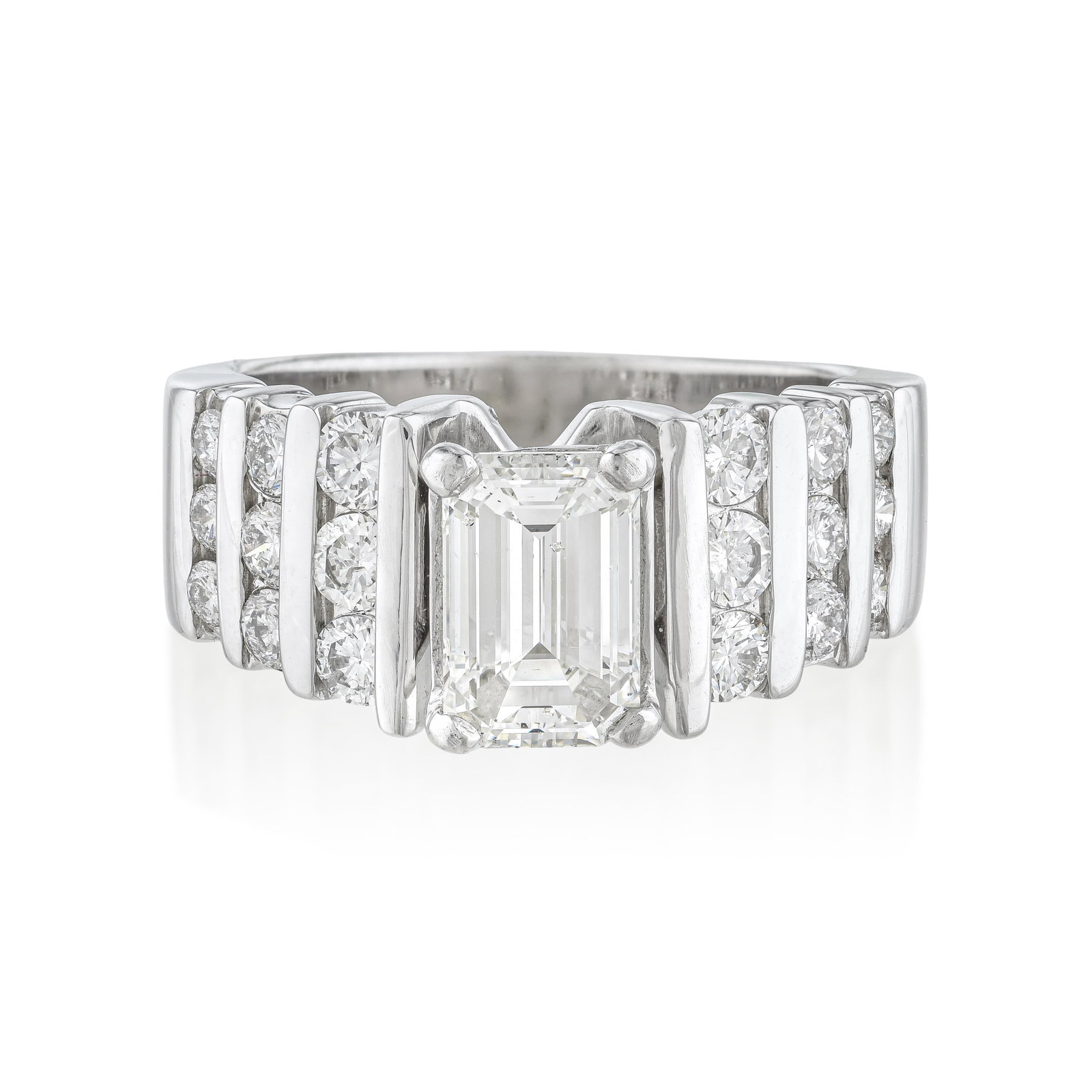 Emerald Cut Diamond Ring: Summary of Key Characteristics • Metal: 14K white gold • Gemstone(s): (1) emerald cut diamond approx. 1.37 carats G-H/VS; round brilliant cut diamonds approx. 0.88 carats total • M