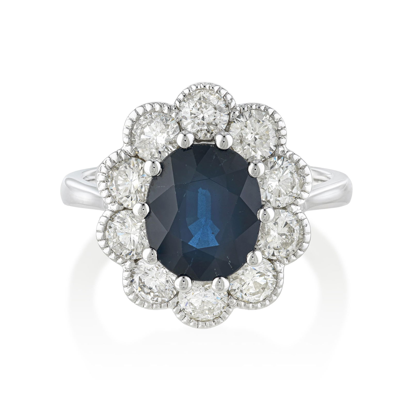 2.33-Carat Sapphire and Diamond Ring: A 2.33-carat oval ruby — the description notes 'sapphire' in the title but the gemstone spec confirms ruby — with approximately 1.33 carats of H-I/SI round brilliant diamonds in 18K white