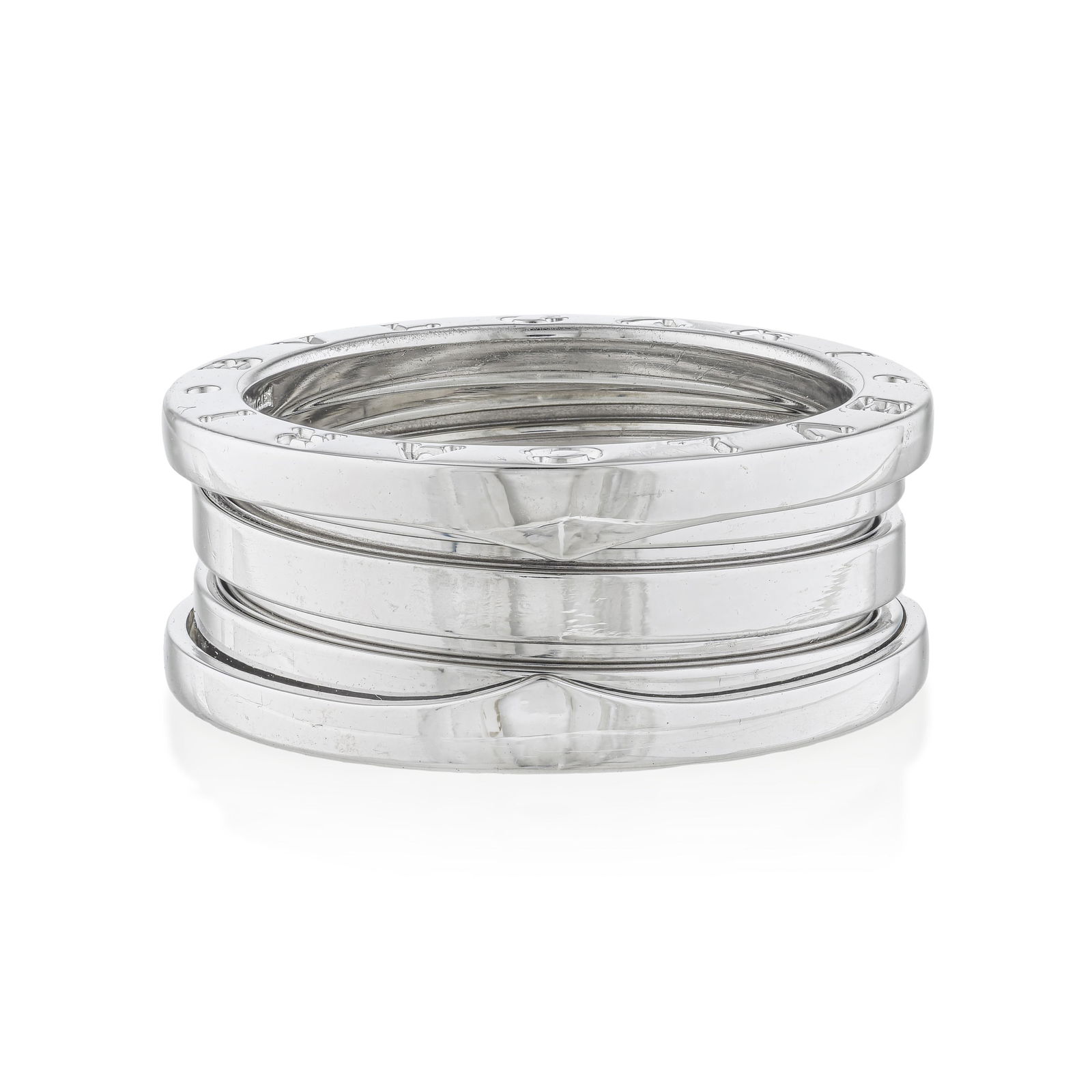 Bulgari B.Zero1 Four-Band Ring: The Bulgari B.Zero1 four-band ring in 18K white gold is one of the most architecturally successful jewelry designs of the past thirty years — the stacked spiral bands of gold, inspired by the