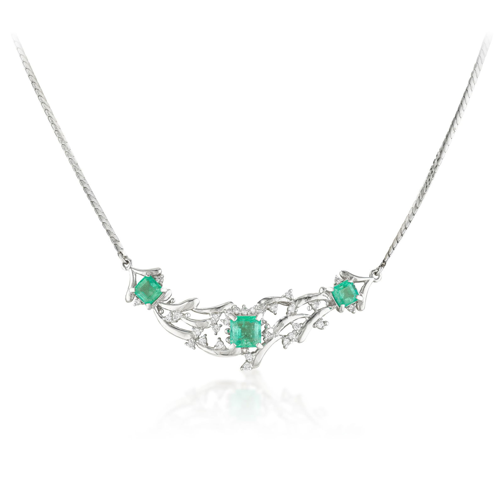 Emerald and Diamond Necklace: Emerald-cut emeralds and round brilliant diamonds have a pleasing visual dialogue — the deliberate, architectural light of the emeralds set against the scintillating fire of the diamonds. This