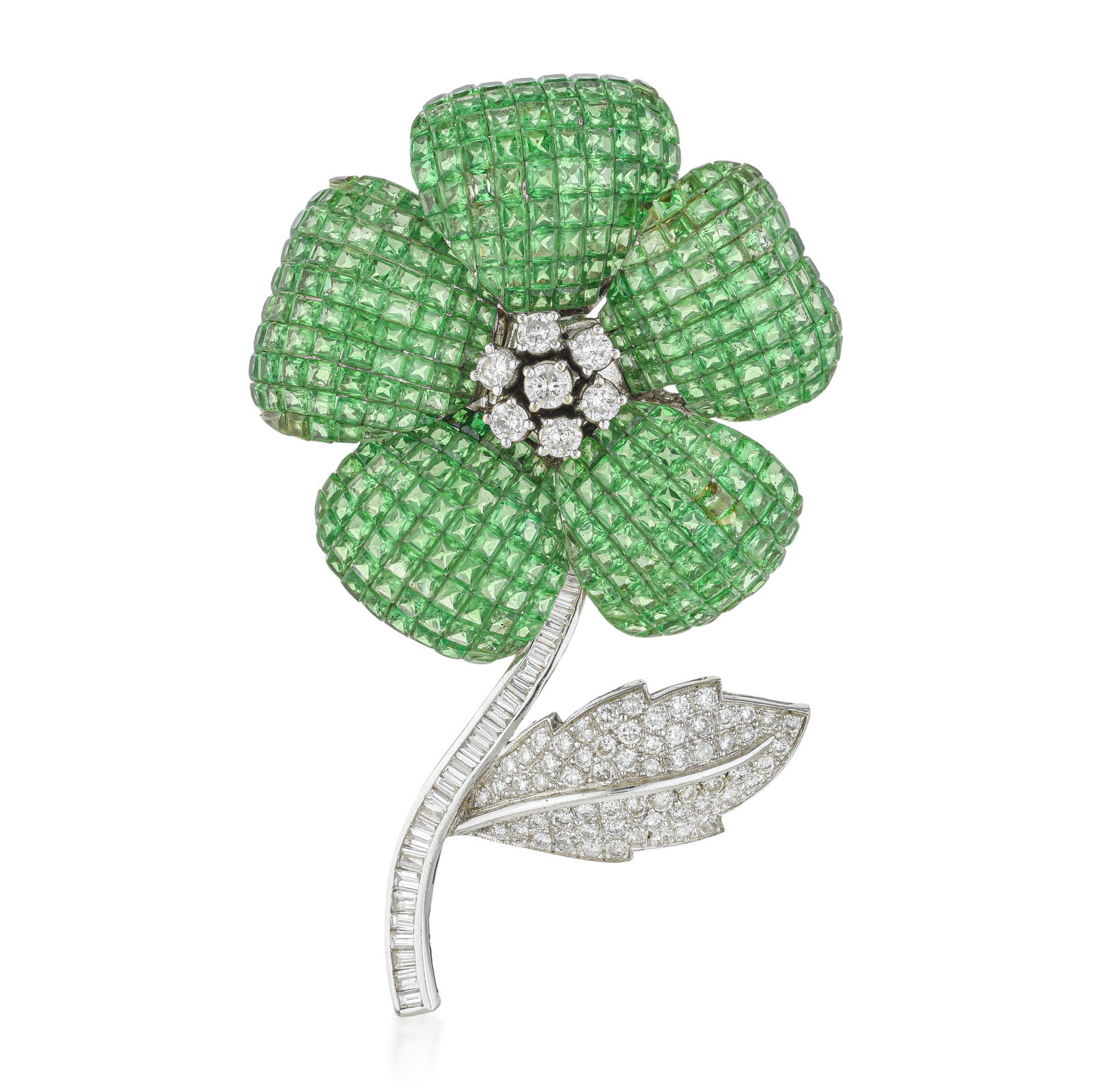 Invisibly Set Tsavorite and Diamond Flower Pin: ESTIMATED RETAIL PRICE: $31,000* *This is the estimated value a piece of similar quality, craftsmanship, and characteristics could command at retail. Thirty-six carats of invisibly set tsavorite