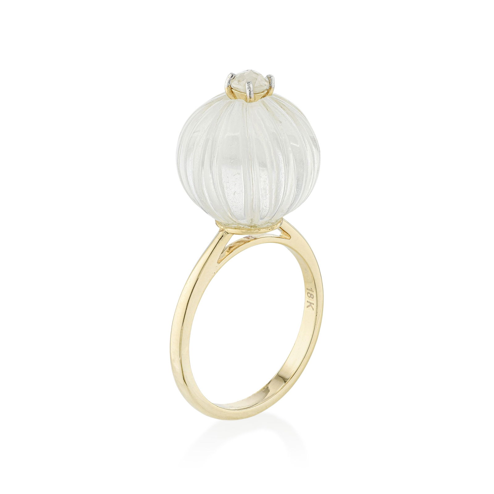 Carved Rock Crystal and Diamond Ring - No Reserve Lot: Rock crystal is glass-clear quartz — and its absolute transparency, when carved, becomes its most compelling quality. This 18K yellow gold ring centers an approximately 16.91-carat carved rock