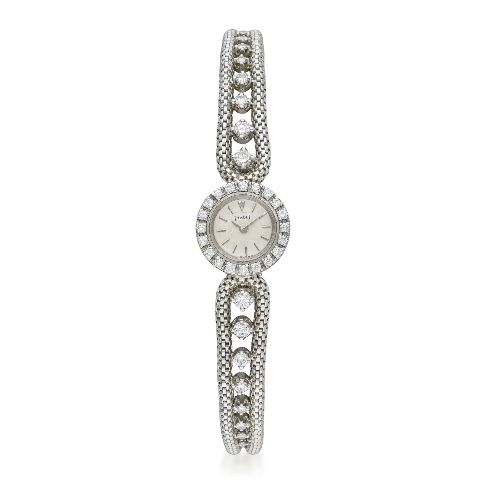 Piaget Dress Watch in 18K White Gold: Summary of Key Characteristics CIRCA: 1950s CASE MATERIAL: 18K white gold DIAL: Opaline white dial with applied hour markers BRACELET MATERIAL: Original bracelet in 18K white gold with diamonds 