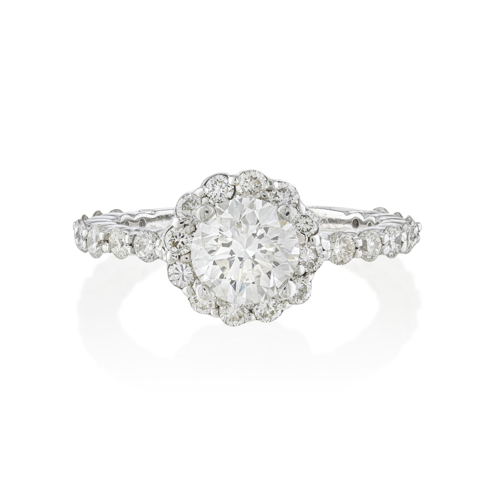 Diamond Engagement Ring: This 18K white gold engagement ring is designed with a graceful diamond flower motif, framed by a delicately scalloped halo and complemented by graduated diamonds along the shank. The refined contours