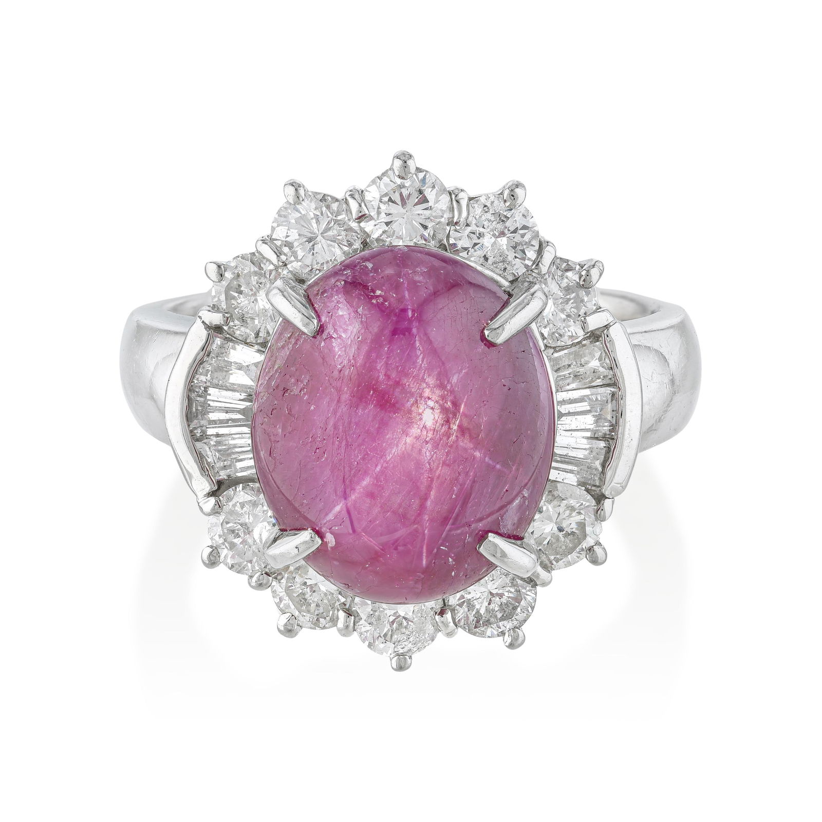 Vintage Star Ruby Cabochon Ring with Diamond Halo: The star ruby is one of nature's most astonishing optical phenomena — a phenomenon that must be seen to be understood. Within this approximately 6.20-carat cabochon, a six-rayed star drifts