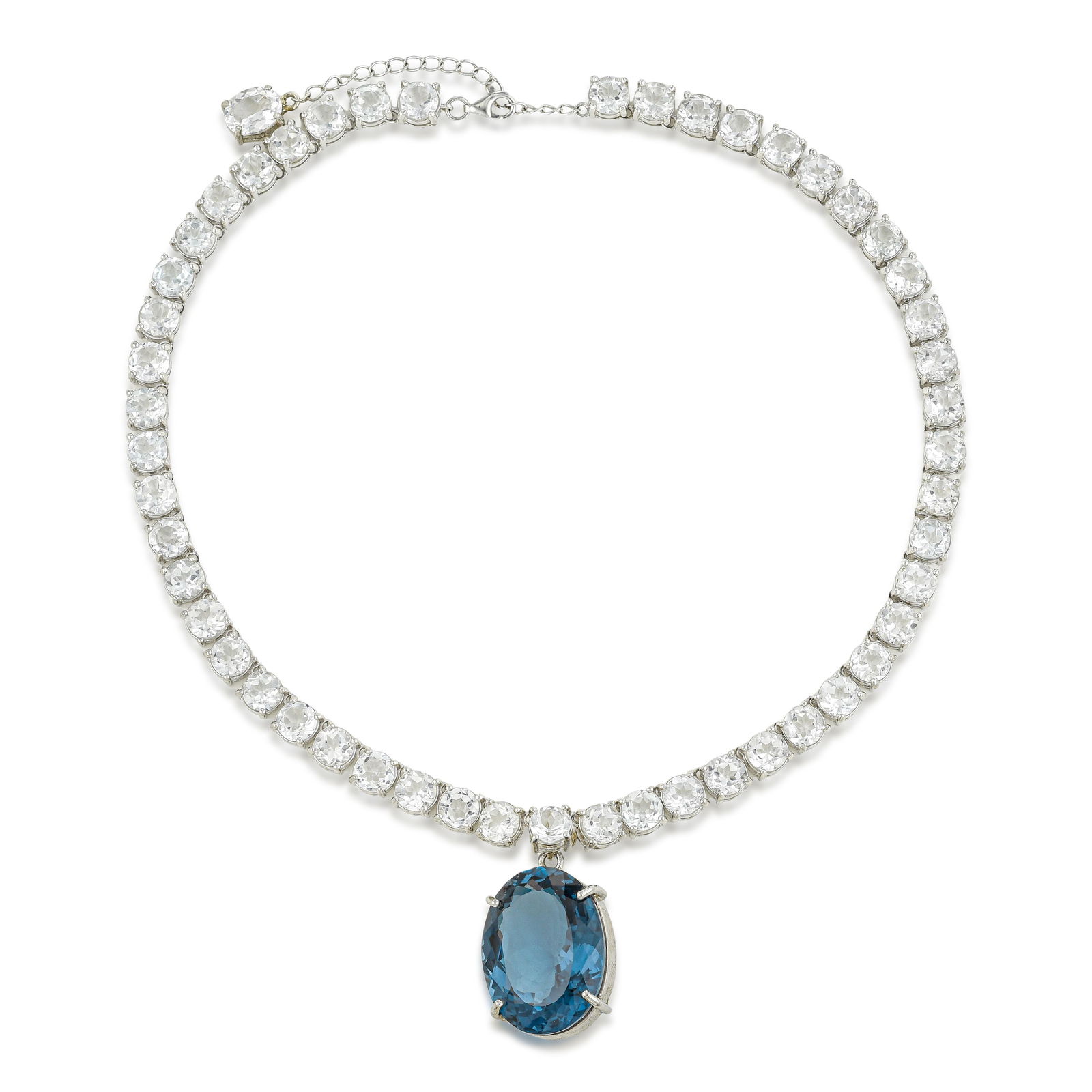 Blue and White Topaz Necklace: Nearly 50 carats of London blue topaz in a silver necklace: the stone's intense blue saturation creates a commanding focal point that reads across a room. White topaz accents provide contrast without