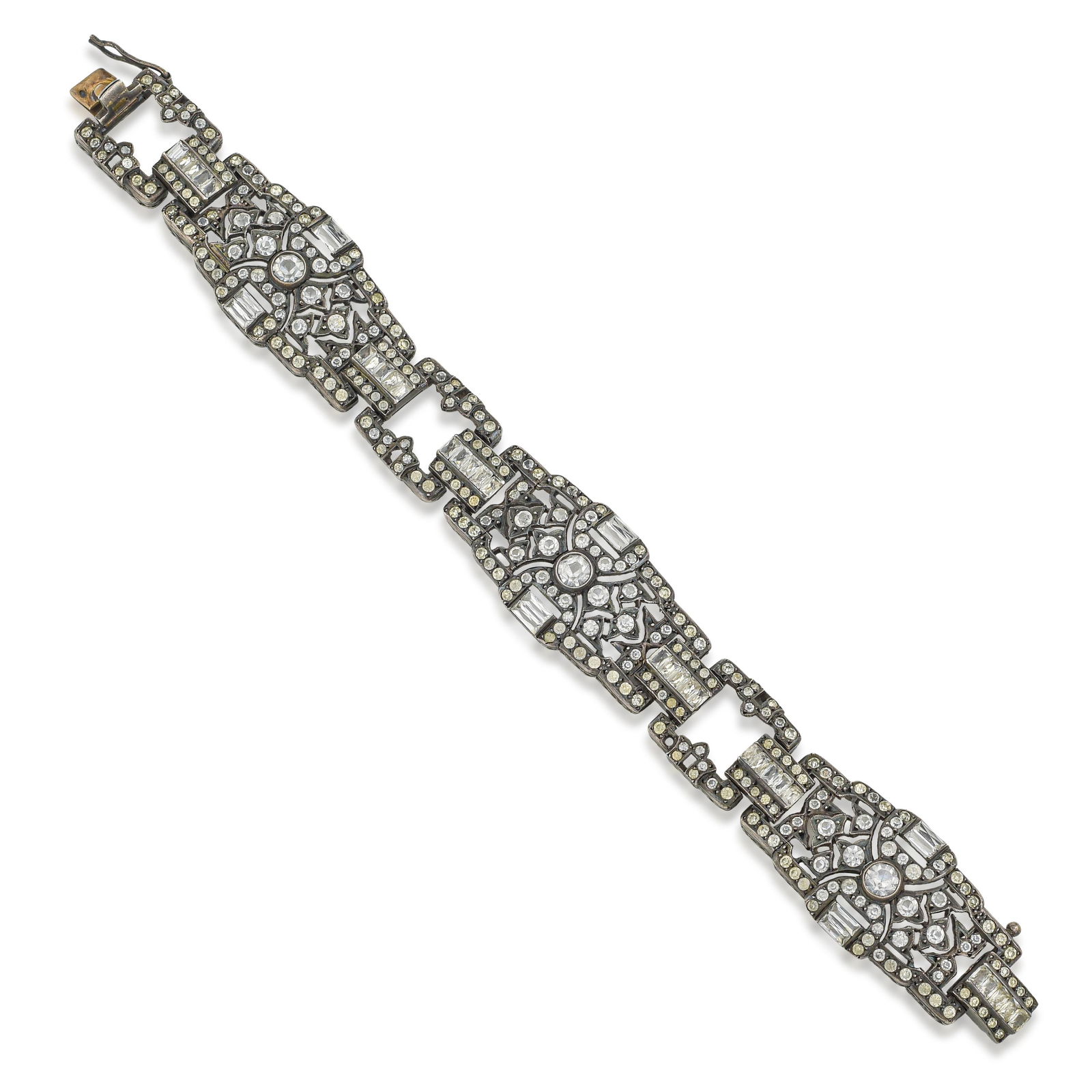 Art Deco Bracelet: Art Deco Costume Bracelet in silver, featuring bold geometric motifs characteristic of the Art Deco period. The stylized design and meticulous craftsmanship capture the glamour of the early 20th