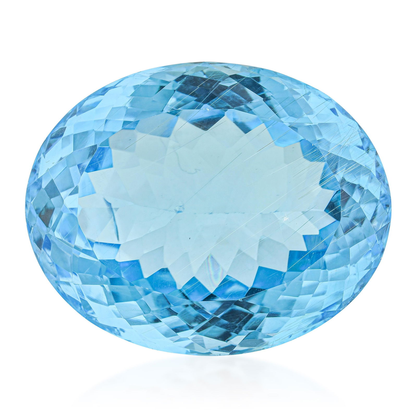 60.20-Carat Oval Fancy Cut Blue Topaz Loose Gemstone: Sixty carats of oval blue topaz in a bright sky blue: fine transparency and precision faceting in a stone large enough to dominate any design built around it. A designer's stone of considerable