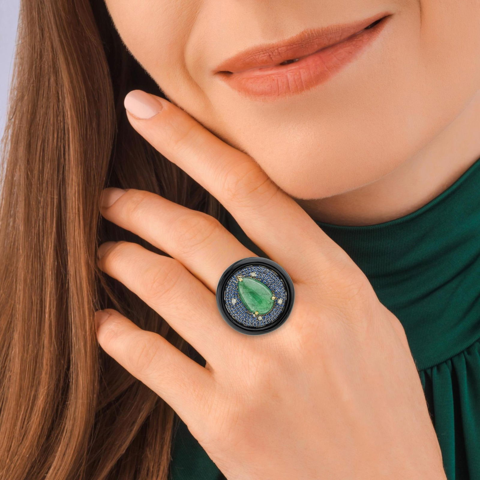 Emerald Cabochon Sapphire Onyx and Diamond Ring - No Reserve Lot: ESTIMATED RETAIL PRICE: $1,600* *This is the estimated value a piece of similar quality, craftsmanship, and characteristics could command at retail. Pear-shape emerald cabochon, round sapphires,