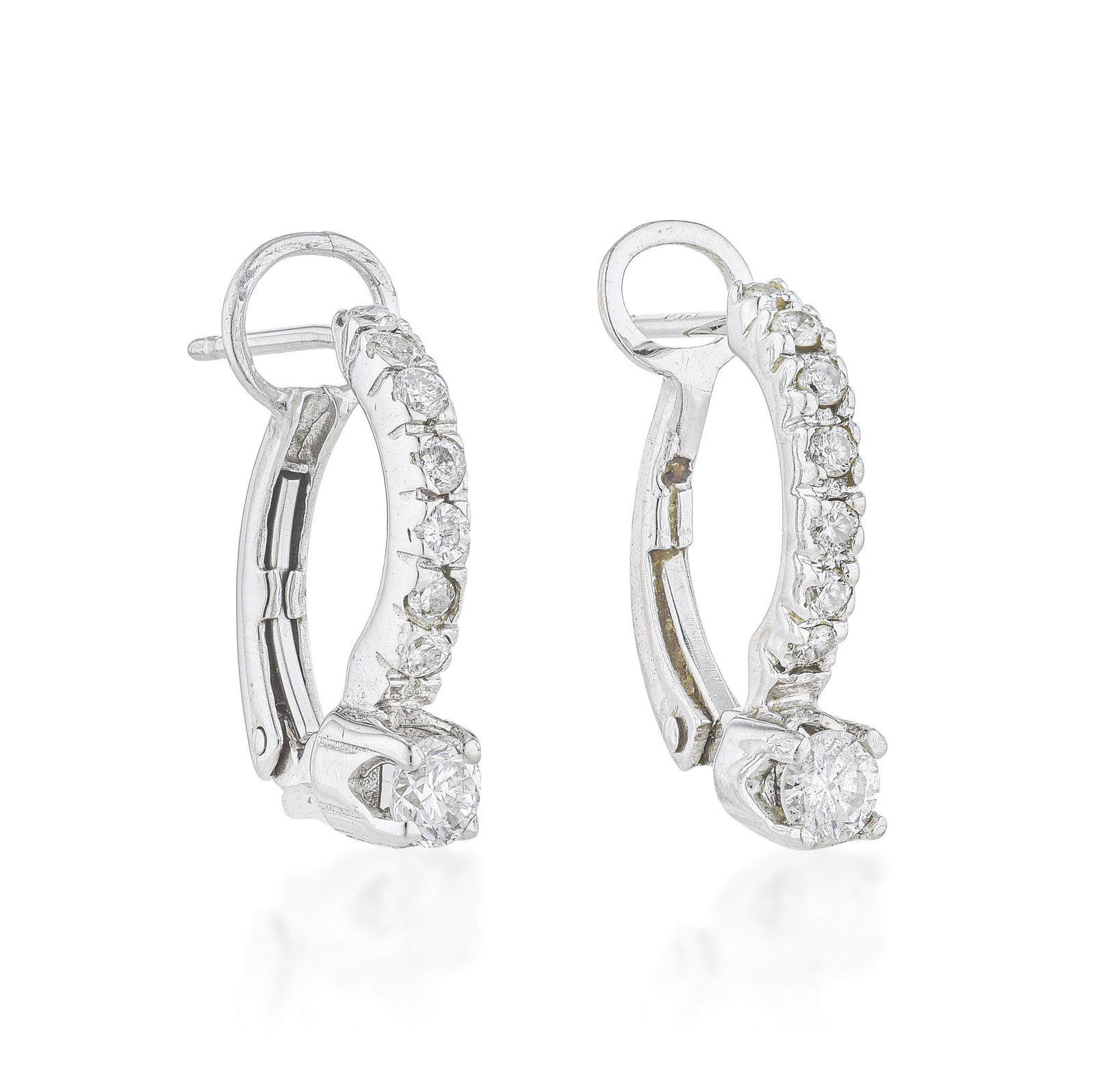 Diamond Earrings: ESTIMATED RETAIL PRICE: $1,000* *This is the estimated value a piece of similar quality, craftsmanship, and characteristics could command at retail. Approximately 0.75 carats of round brilliant