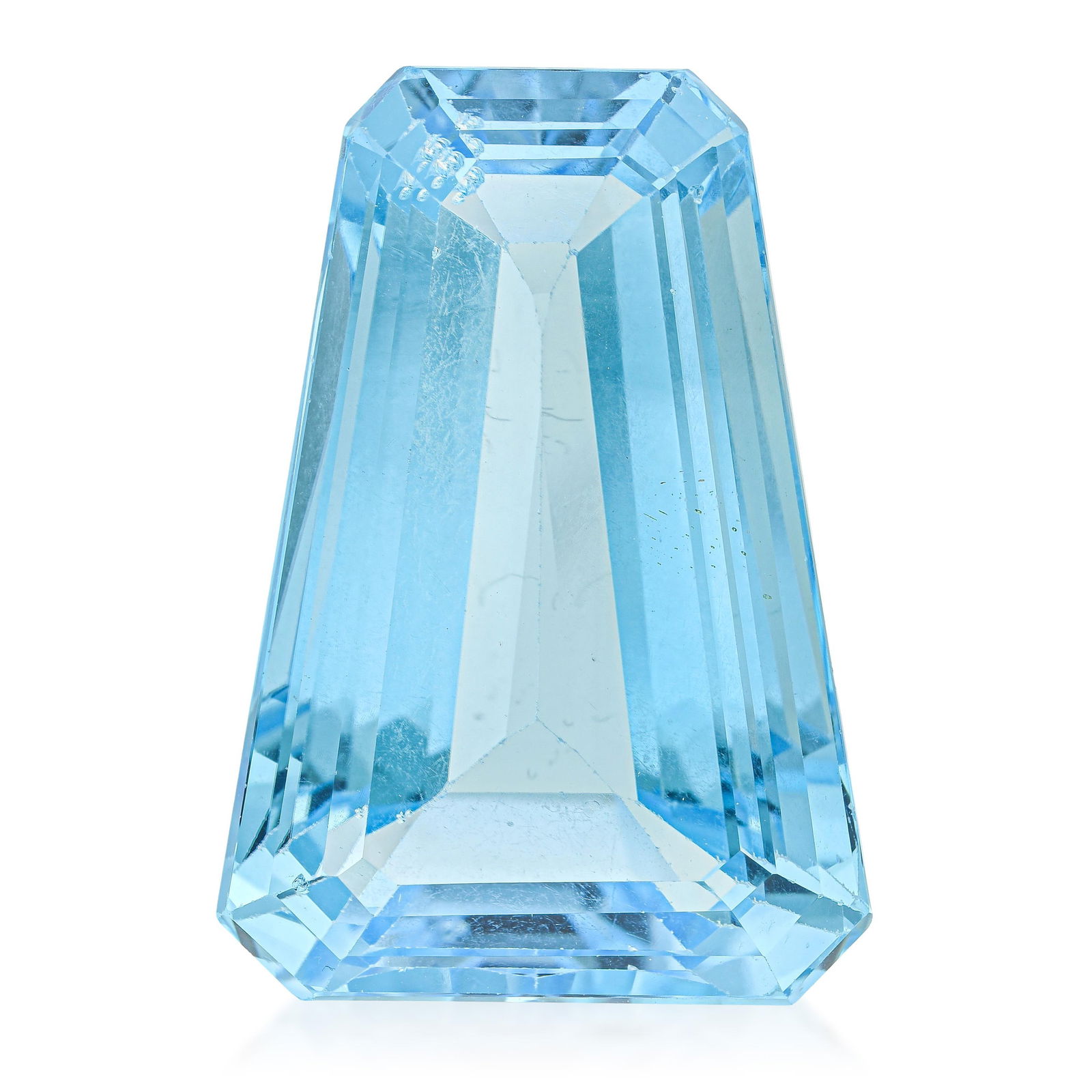 46.50-Carat Trapezoid Cut Blue Topaz Loose Gemstone: ESTIMATED RETAIL PRICE: $250* *This is the estimated value a piece of similar quality, craftsmanship, and characteristics could command at retail. A 46.50-carat trapezoid-cut blue topaz: the