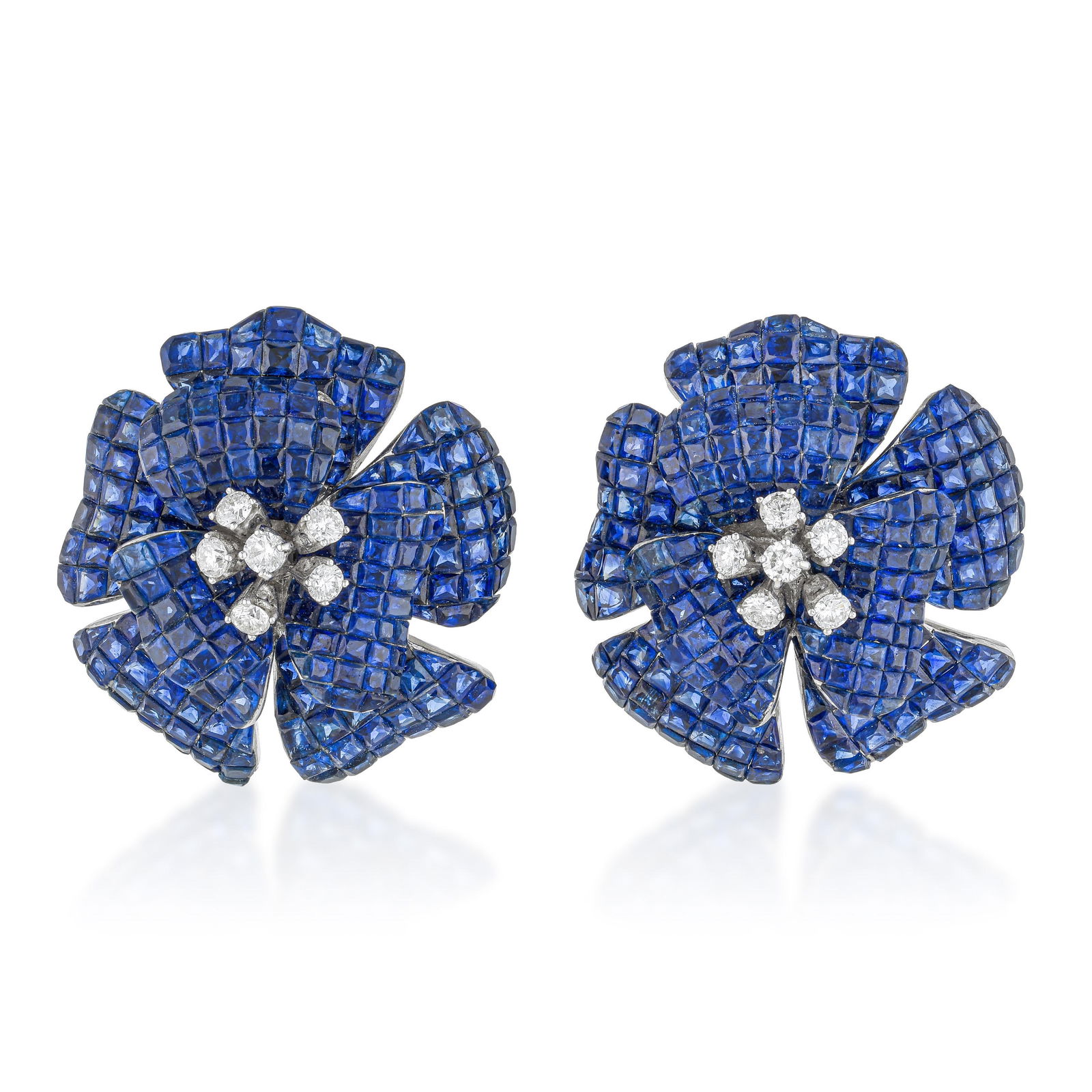 Blue Sapphire Invisibly-Set Flower Earrings: ESTIMATED RETAIL PRICE: $38,000* *This is the estimated value a piece of similar quality, craftsmanship, and characteristics could command at retail. Blue sapphire invisibly-set flower