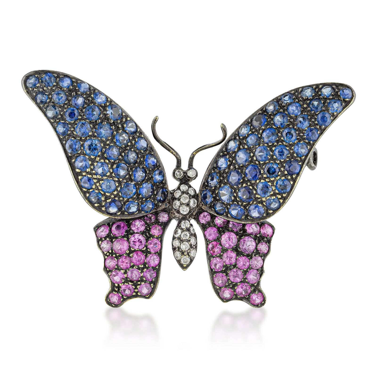 Blue and Pink Sapphire Butterfly Pin: ESTIMATED RETAIL PRICE: $7,000* *This is the estimated value a piece of similar quality, craftsmanship, and characteristics could command at retail. A blue and pink sapphire butterfly pin in