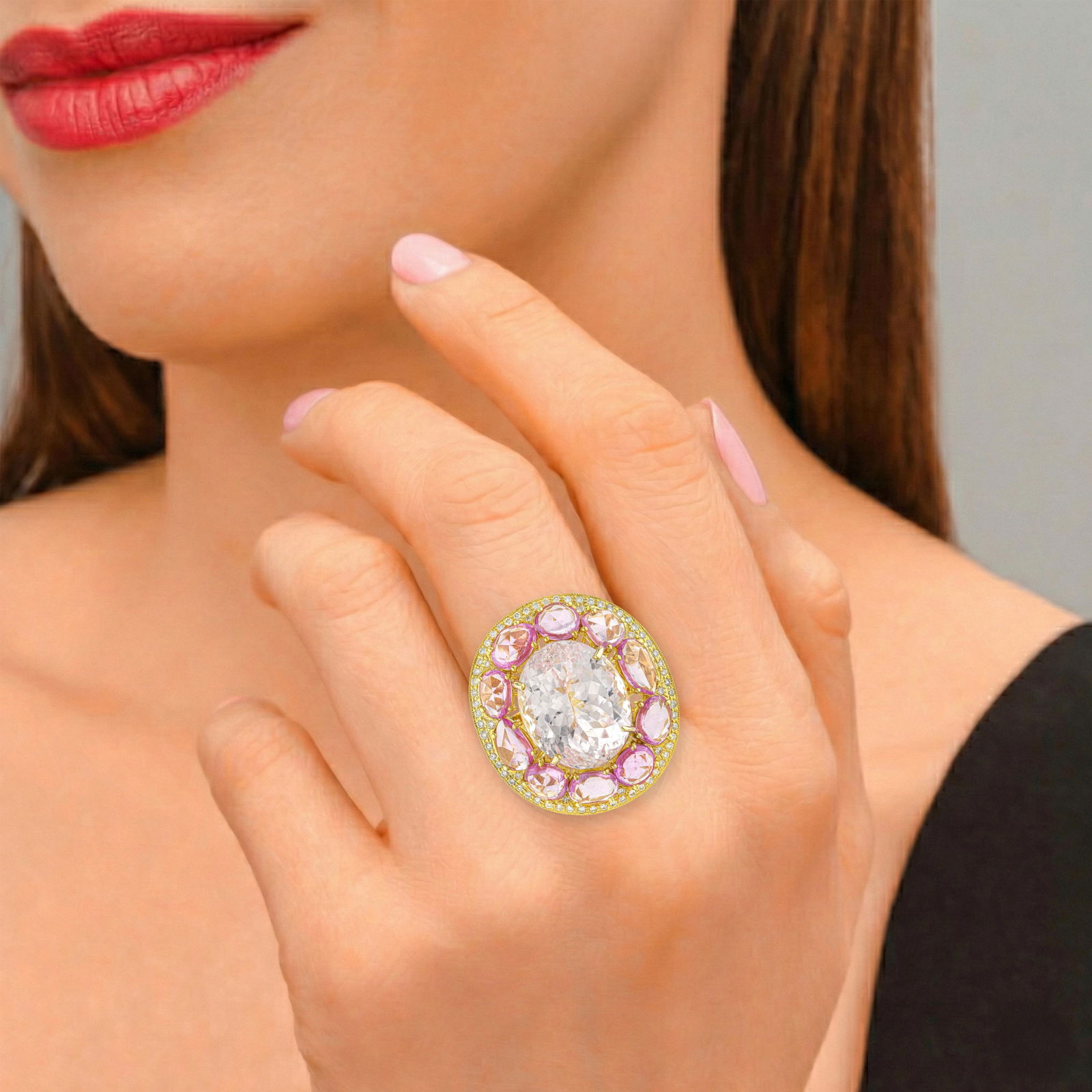 Kunzite Sapphire and Diamond Ring: ESTIMATED RETAIL PRICE: $10,000* *This is the estimated value a piece of similar quality, craftsmanship, and characteristics could command at retail. Kunzite and sapphire together: the soft,