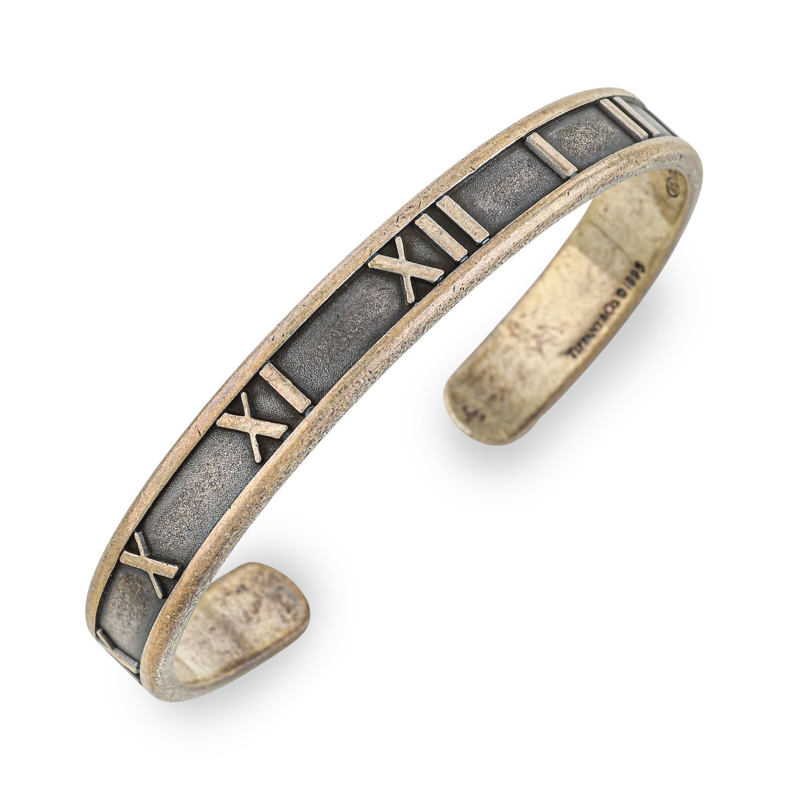 Tiffany Atlas Silver Bangle: ESTIMATED RETAIL PRICE: $800* *This is the estimated value a piece of similar quality, craftsmanship, and characteristics could command at retail. Summary of Key Characteristics • Metal: