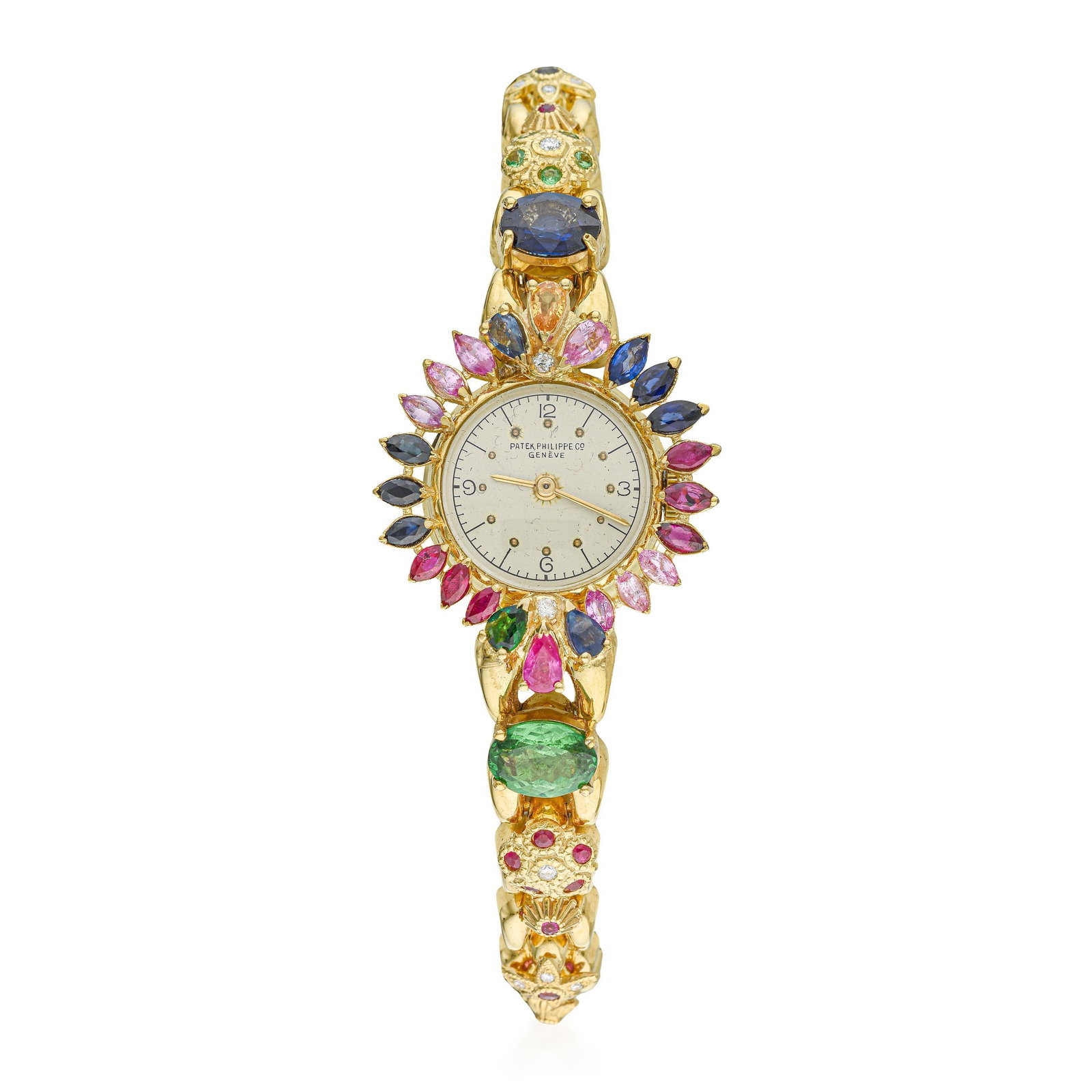 Patek Philippe Ladies Watch in 18K Gold with Colored Stones: Summary of Key CharacteristicsCIRCA: 1950sCASE MATERIAL: 18K yellow gold with colored stones set into the bezelDIAL: Opaline white dial with applied hour markers and Arabic numeralsCASE DIMENSIONS: 27