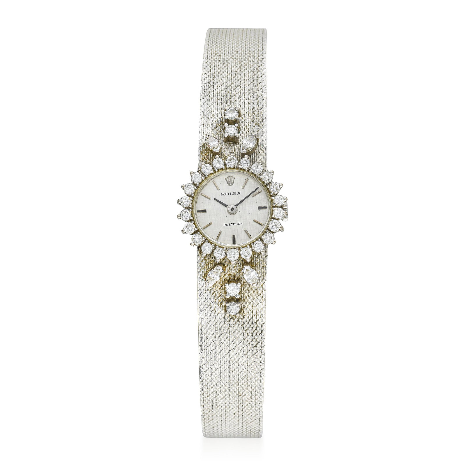 Rolex Ladies' Precision in 18K white gold: Summary of Key Characteristics CIRCA: 1970 CASE MATERIAL: 18K white gold with factory diamonds DIAL: Silver linen dial with applied hour markers CASE DIMENSIONS: 18 mm in diameter BRACELET MATERIAL: