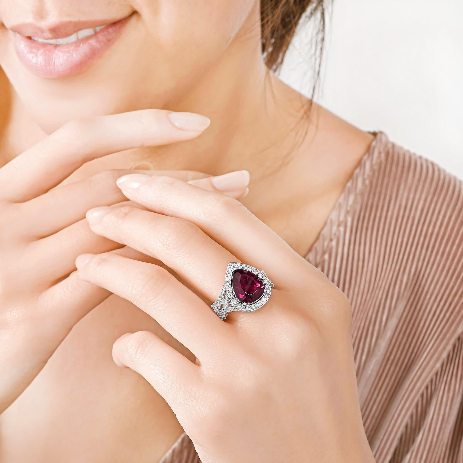Pear-Shaped Rubellite and Diamond Ring: ESTIMATED RETAIL PRICE: $8,000* *This is the estimated value a piece of similar quality, craftsmanship, and characteristics could command at retail. The raspberry-to-red range of tourmaline that