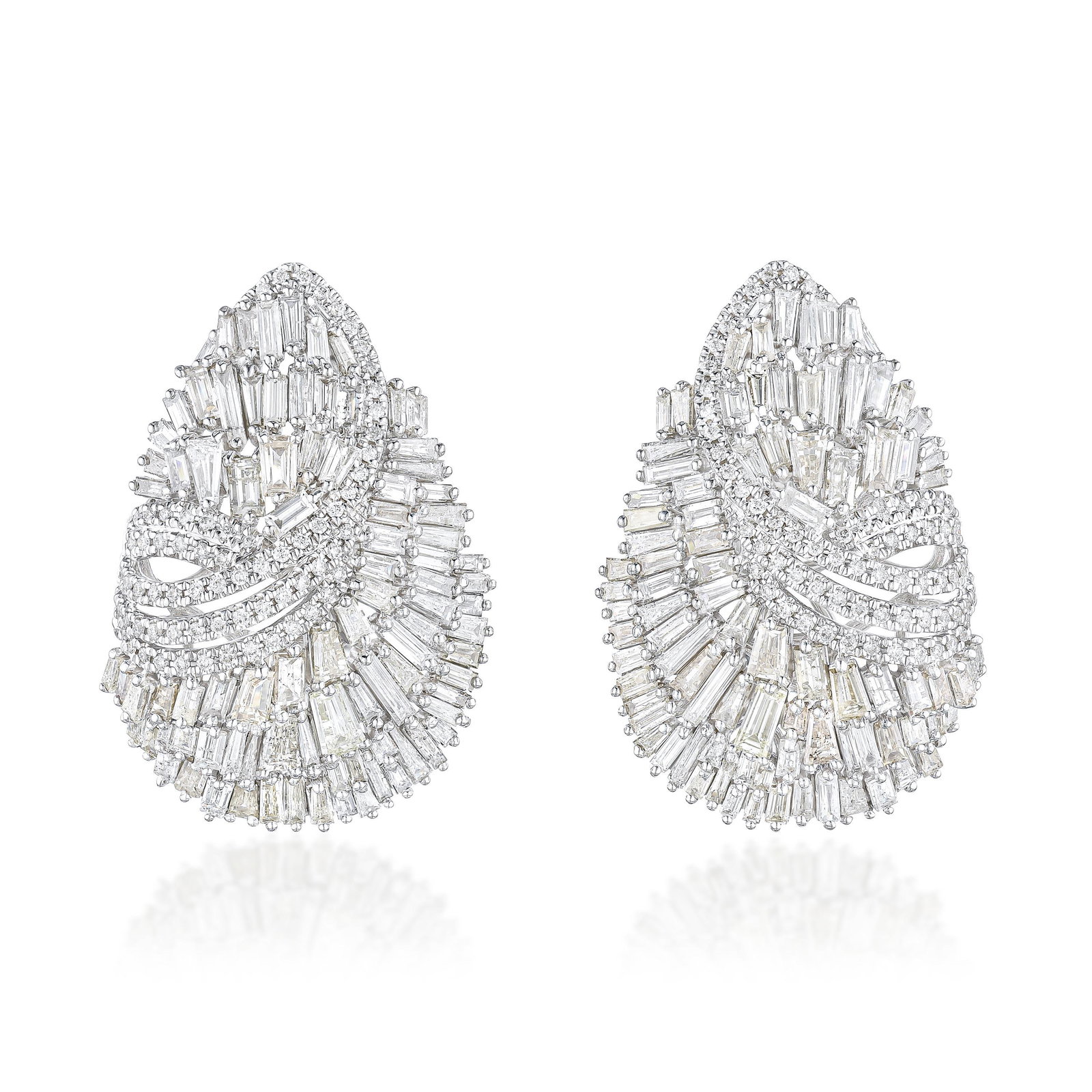 Diamond Cluster Earrings: ESTIMATED RETAIL PRICE: $10,500**This is the estimated value a piece of similar quality, craftsmanship, and characteristics could command at retail.Combining rectangular step-cut and round brilliant d