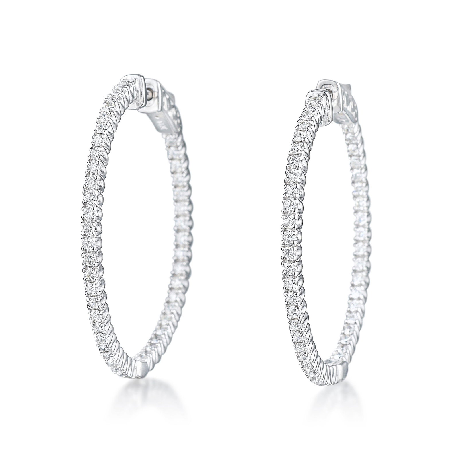 Diamond Inside-Out Hoop Earrings, 1-3/8" Diameter: ESTIMATED RETAIL PRICE: $3,400* *This is the estimated value a piece of similar quality, craftsmanship, and characteristics could command at retail. The circular form in jewelry is closed and