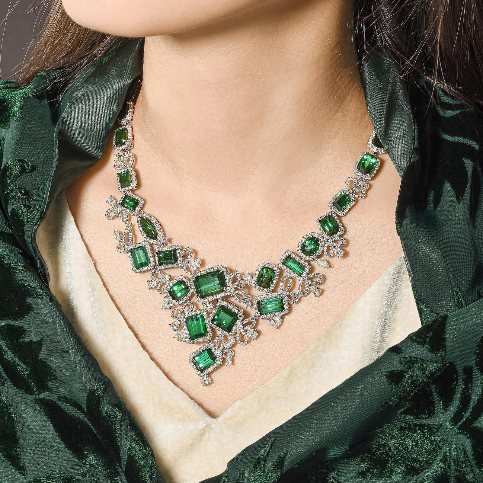 Tourmaline and Diamond Bib Necklace: ESTIMATED RETAIL PRICE: $165,000* *This is the estimated value a piece of similar quality, craftsmanship, and characteristics could command at retail. Summary of Key Characteristics • Metal: