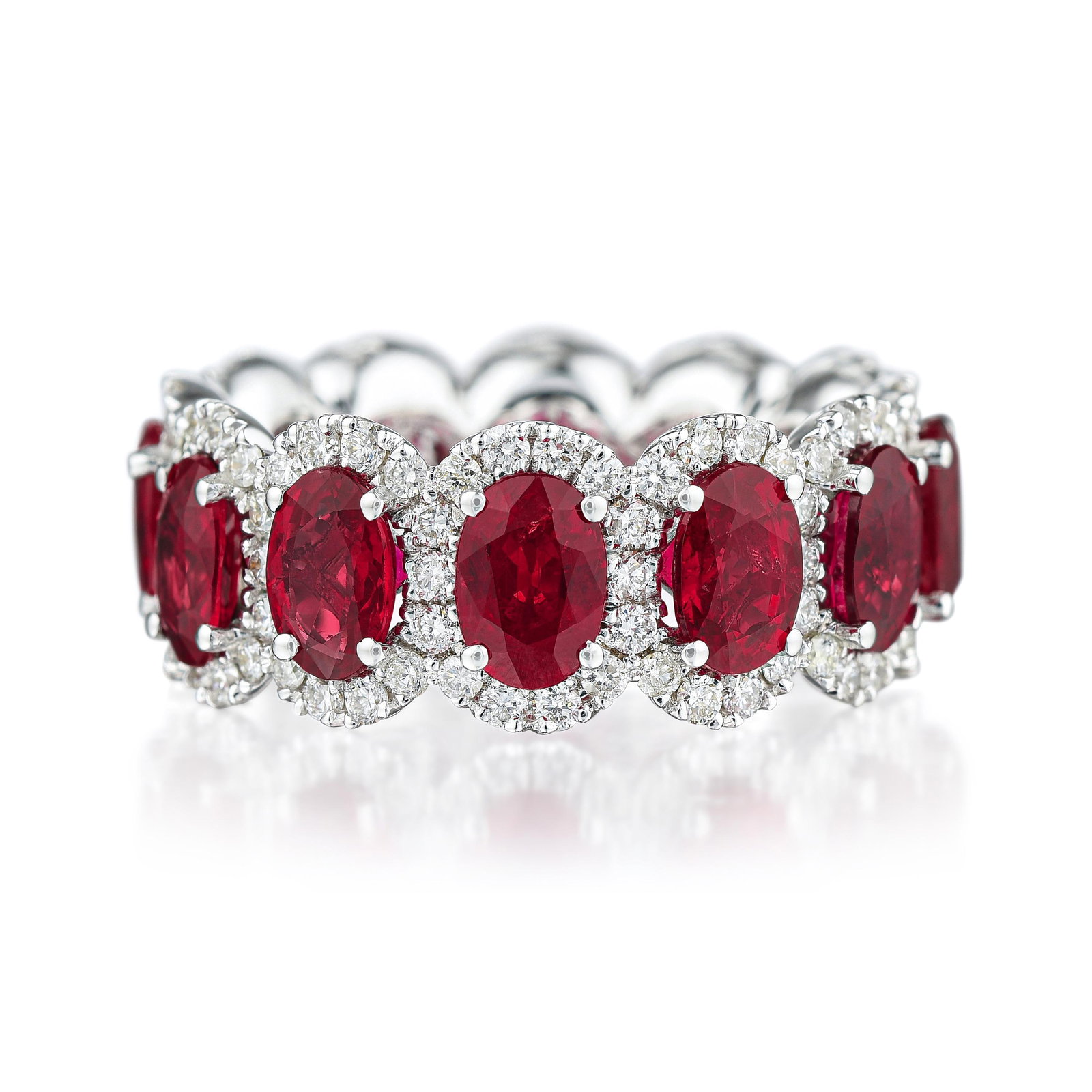 Ruby and Diamond Eternity Ring: ESTIMATED RETAIL PRICE: $14,000* *This is the estimated value a piece of similar quality, craftsmanship, and characteristics could command at retail. A band set with 6.59 carats of oval rubies at