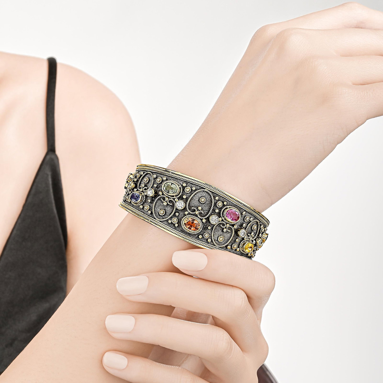 Multi-Colored Sapphire and Diamond Cuff: ESTIMATED RETAIL PRICE: $28,000* *This is the estimated value a piece of similar quality, craftsmanship, and characteristics could command at retail. Summary of Key Characteristics • Metal: