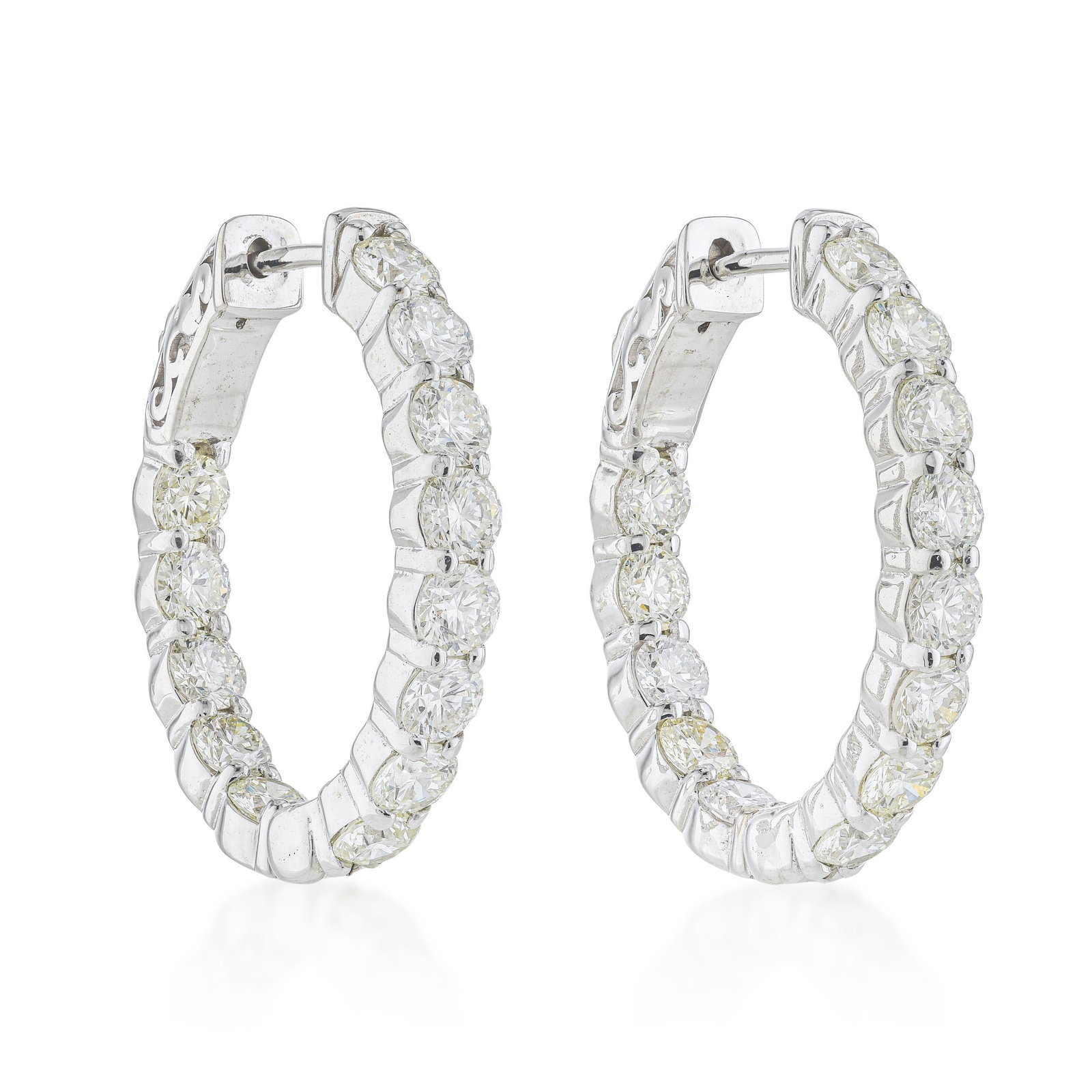 Inside Out Diamond Hoop Earrings: ESTIMATED RETAIL PRICE: $11,000* *This is the estimated value a piece of similar quality, craftsmanship, and characteristics could command at retail. Summary of Key Characteristics • Metal: