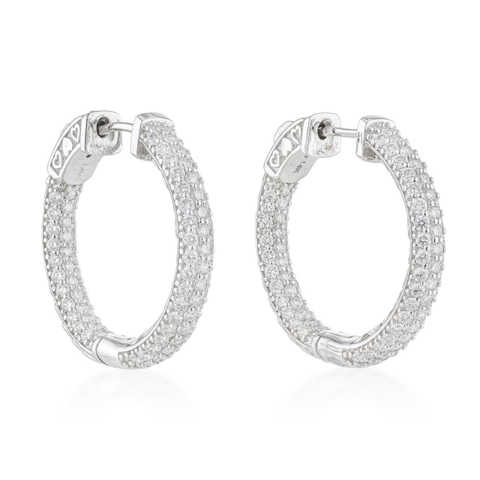 Diamond Pave Hoop Earrings: ESTIMATED RETAIL PRICE: $6,000* *This is the estimated value a piece of similar quality, craftsmanship, and characteristics could command at retail. Pave hoops at 2.60 carats total sit above the