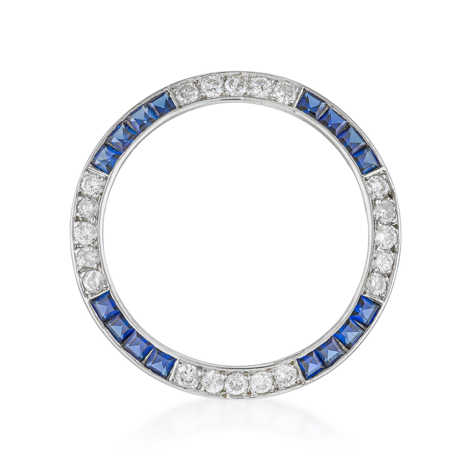 Sapphire And Diamond Circle Pin: ESTIMATED RETAIL PRICE: $4,000* *This is the estimated value a piece of similar quality, craftsmanship, and characteristics could command at retail. A sapphire and diamond circle pin in 14K white