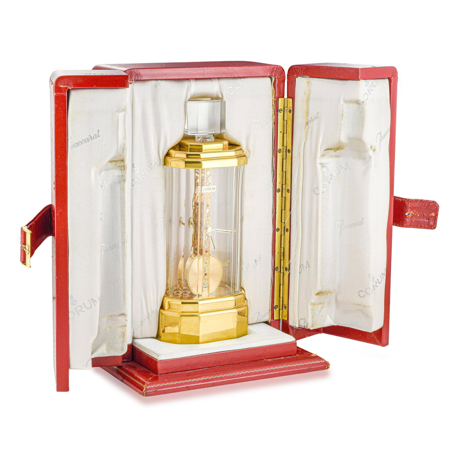 Corum Baccarat Golden Bridge Desk Clock in Brass and 18K Gold: ESTIMATED RETAIL PRICE: $12,000* *This is the estimated value a piece of similar quality, craftsmanship, and characteristics could command at retail. Summary of Key Characteristics CIRCA: 1980s CASE M