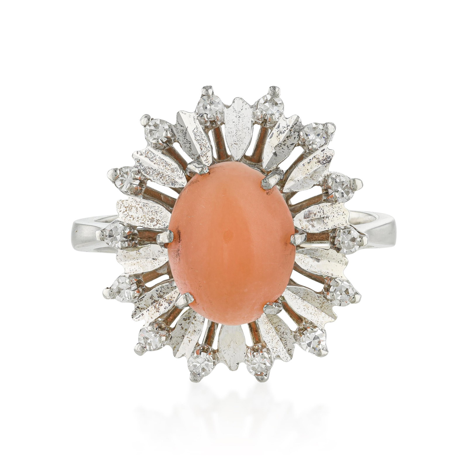 Coral and Diamond Ring: ESTIMATED RETAIL PRICE: $2,000* *This is the estimated value a piece of similar quality, craftsmanship, and characteristics could command at retail. Coral cabochon rings in a diamond sunburst setting 