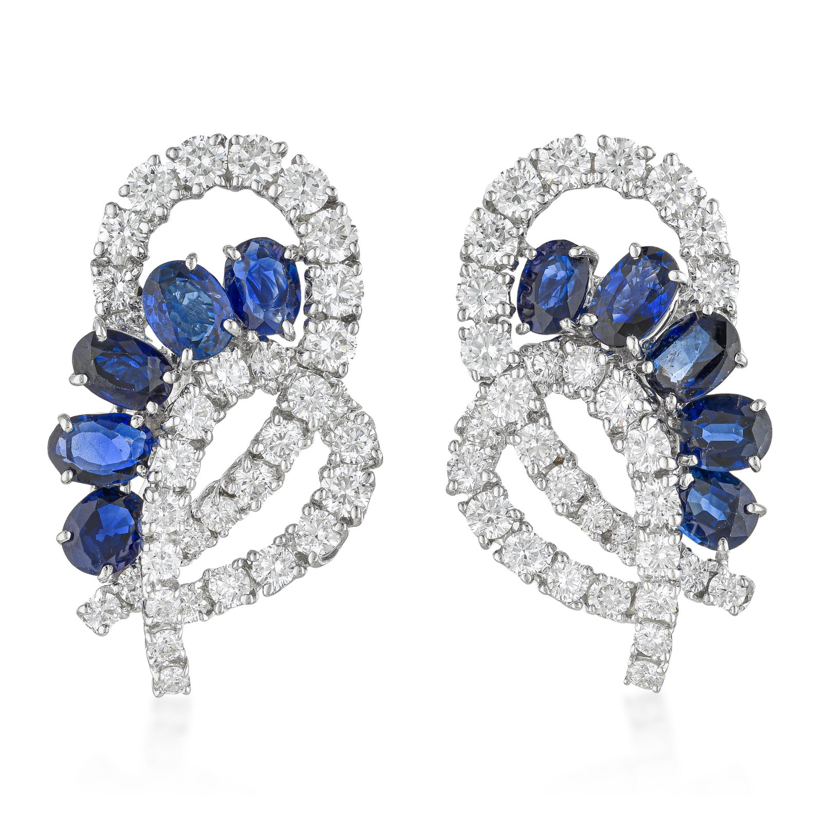 Scroll Diamond and Sapphire Earrings: ESTIMATED RETAIL PRICE: $12,000* *This is the estimated value a piece of similar quality, craftsmanship, and characteristics could command at retail. Diamond quality at E-F/VS is meaningfully above