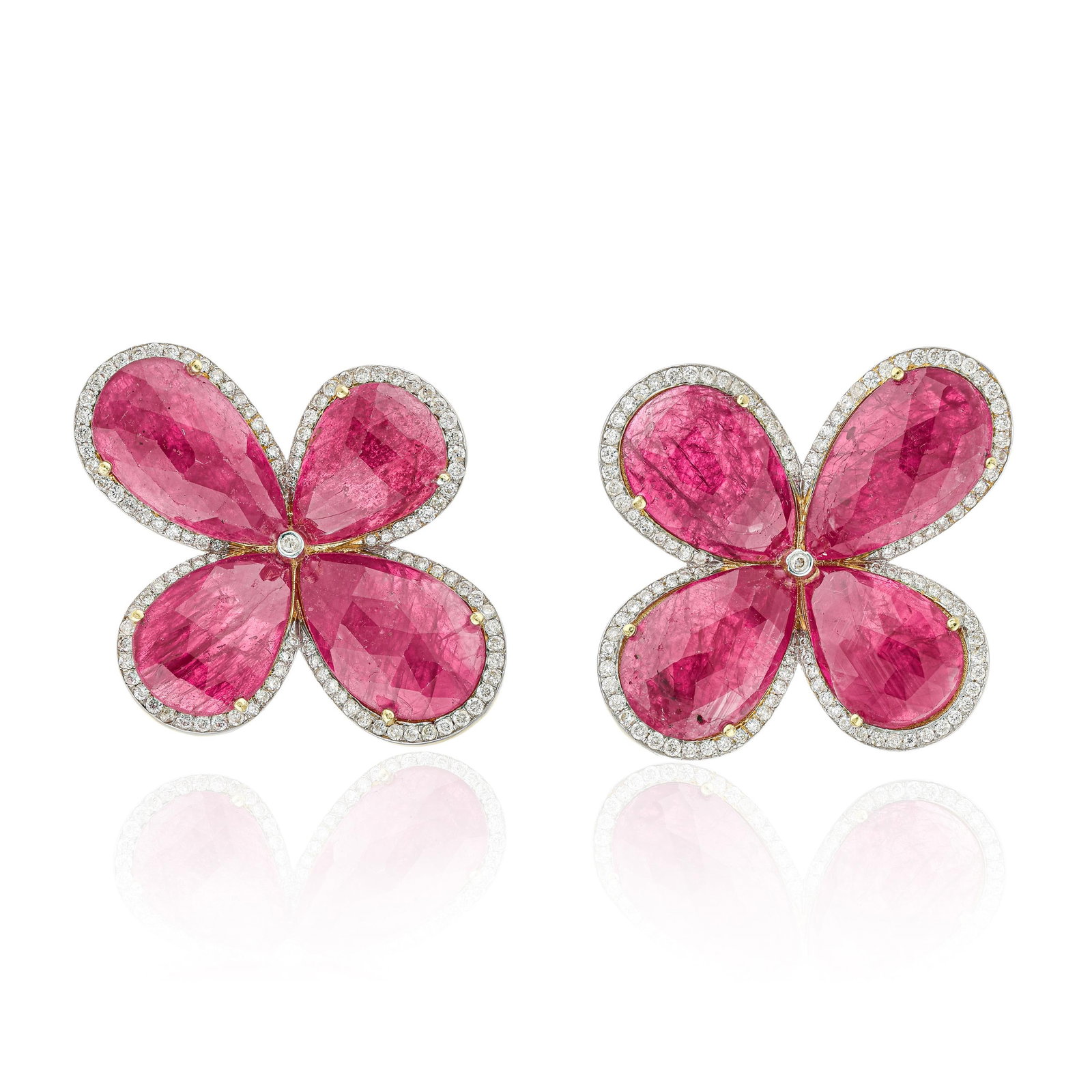 Ruby and Diamond Flower Earrings: ESTIMATED RETAIL PRICE: $6,500* *This is the estimated value a piece of similar quality, craftsmanship, and characteristics could command at retail. Ruby cabochons in a floral arrangement require a