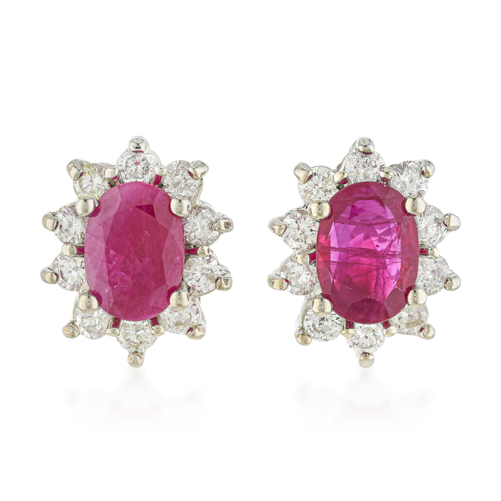 Ruby and Diamond Cluster Earrings: ESTIMATED RETAIL PRICE: $4,000* *This is the estimated value a piece of similar quality, craftsmanship, and characteristics could command at retail. The oval ruby cluster earring — a vivid