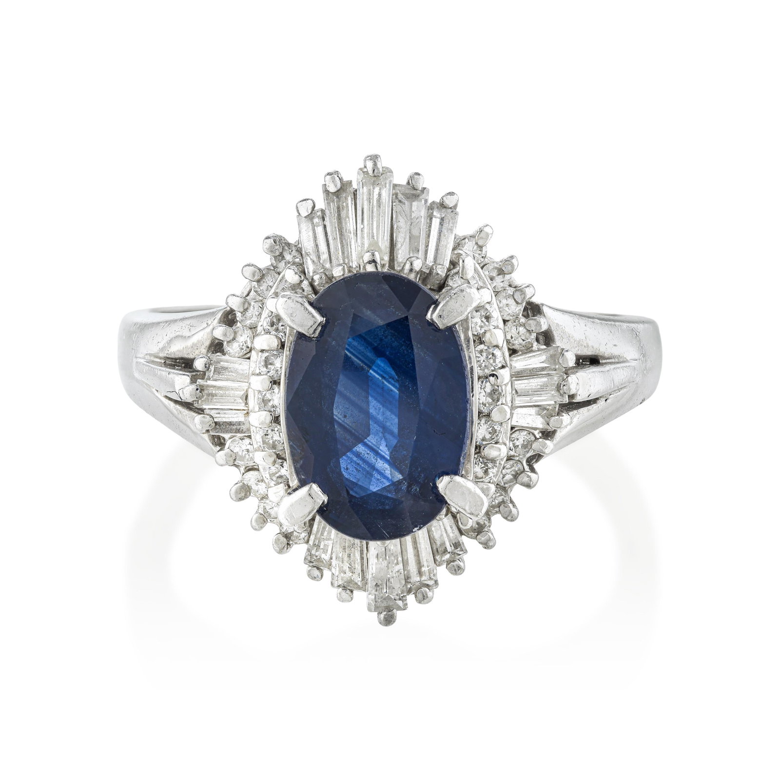 Sapphire and Diamond Ring: ESTIMATED RETAIL PRICE: $4,500* *This is the estimated value a piece of similar quality, craftsmanship, and characteristics could command at retail. The oval diamond halo around a 1.84-carat center sa