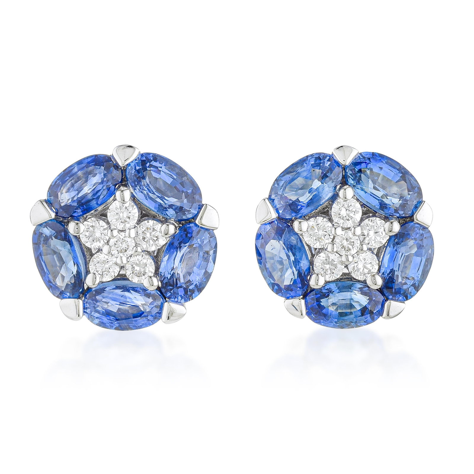 Sapphire and Diamond Star Earrings: ESTIMATED RETAIL PRICE: $7,500* *This is the estimated value a piece of similar quality, craftsmanship, and characteristics could command at retail. The star format arranges 10 sapphires radially arou