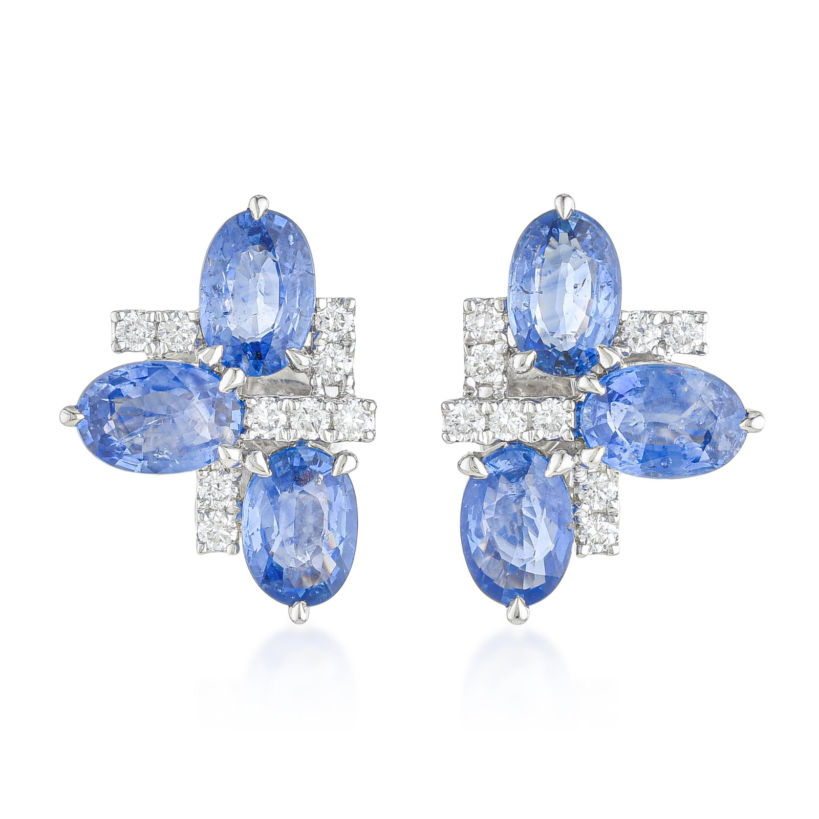 Sapphire and Diamond Cluster Earrings: ESTIMATED RETAIL PRICE: $7,500* *This is the estimated value a piece of similar quality, craftsmanship, and characteristics could command at retail. Six sapphires at 3.53 carats arranged in a compact