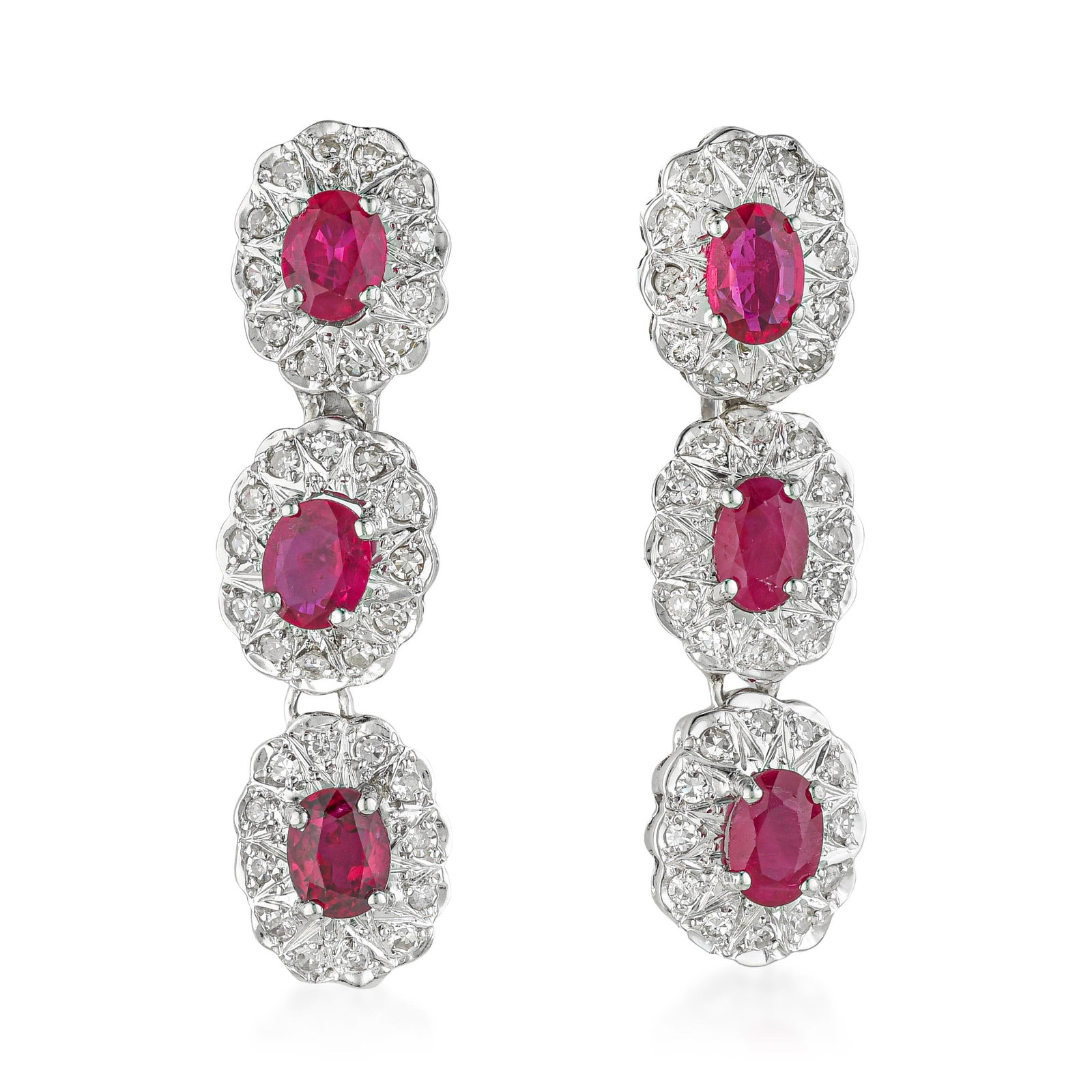 Ruby and Diamond Earrings: ESTIMATED RETAIL PRICE: $7,000* *This is the estimated value a piece of similar quality, craftsmanship, and characteristics could command at retail. Three oval rubies descending in a graduated drop,