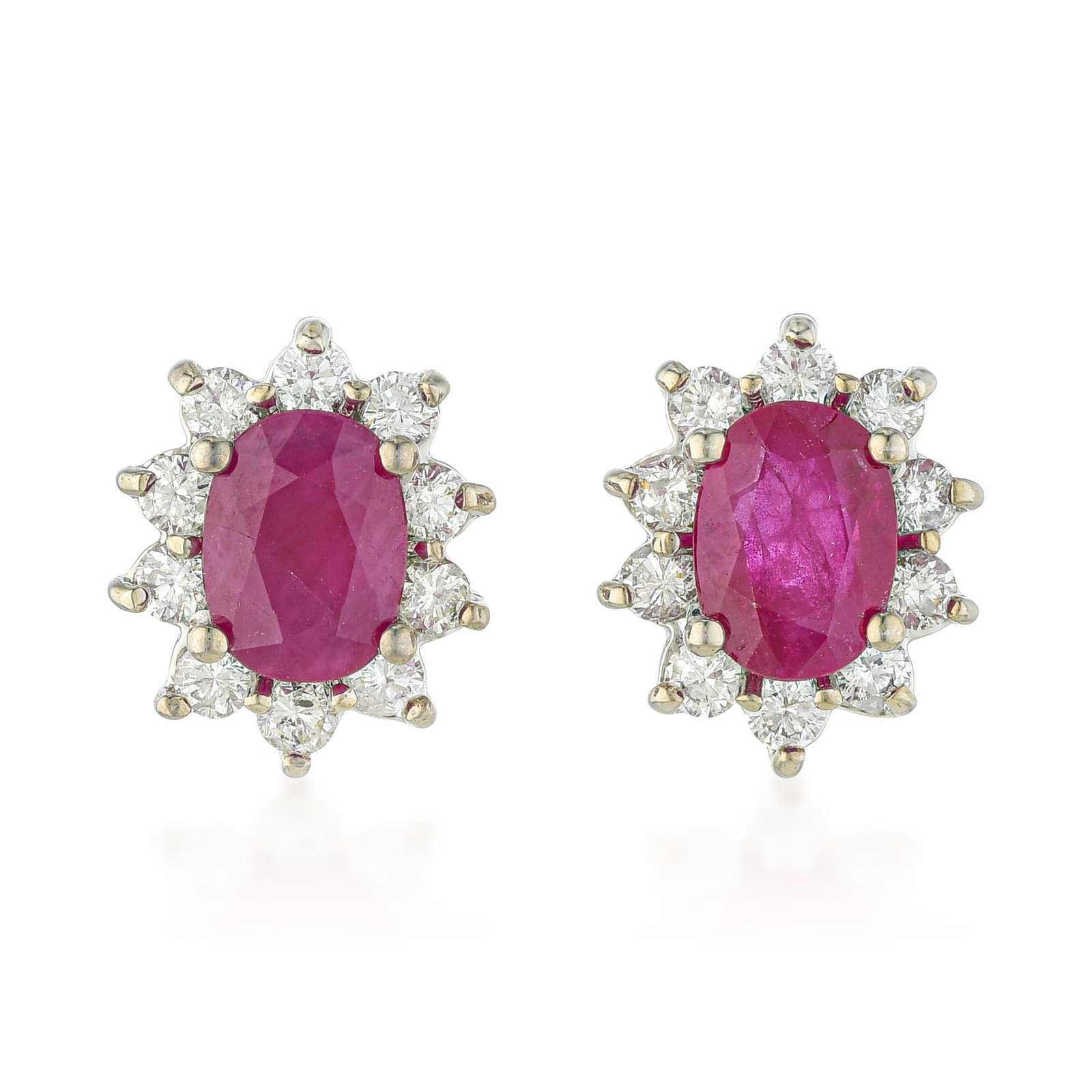 Ruby and Diamond Cluster Earrings: ESTIMATED RETAIL PRICE: $4,000* *This is the estimated value a piece of similar quality, craftsmanship, and characteristics could command at retail. The oval ruby cluster earring — a vivid
