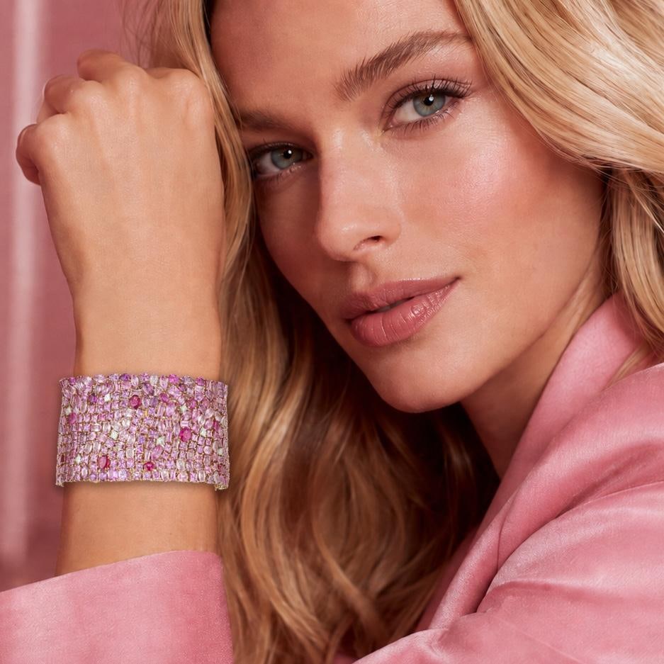 Pink Sapphire and Diamond Wide Bracelet: ESTIMATED RETAIL PRICE: $100,000* *This is the estimated value a piece of similar quality, craftsmanship, and characteristics could command at retail. This spectacular bracelet is a breathtaking tour